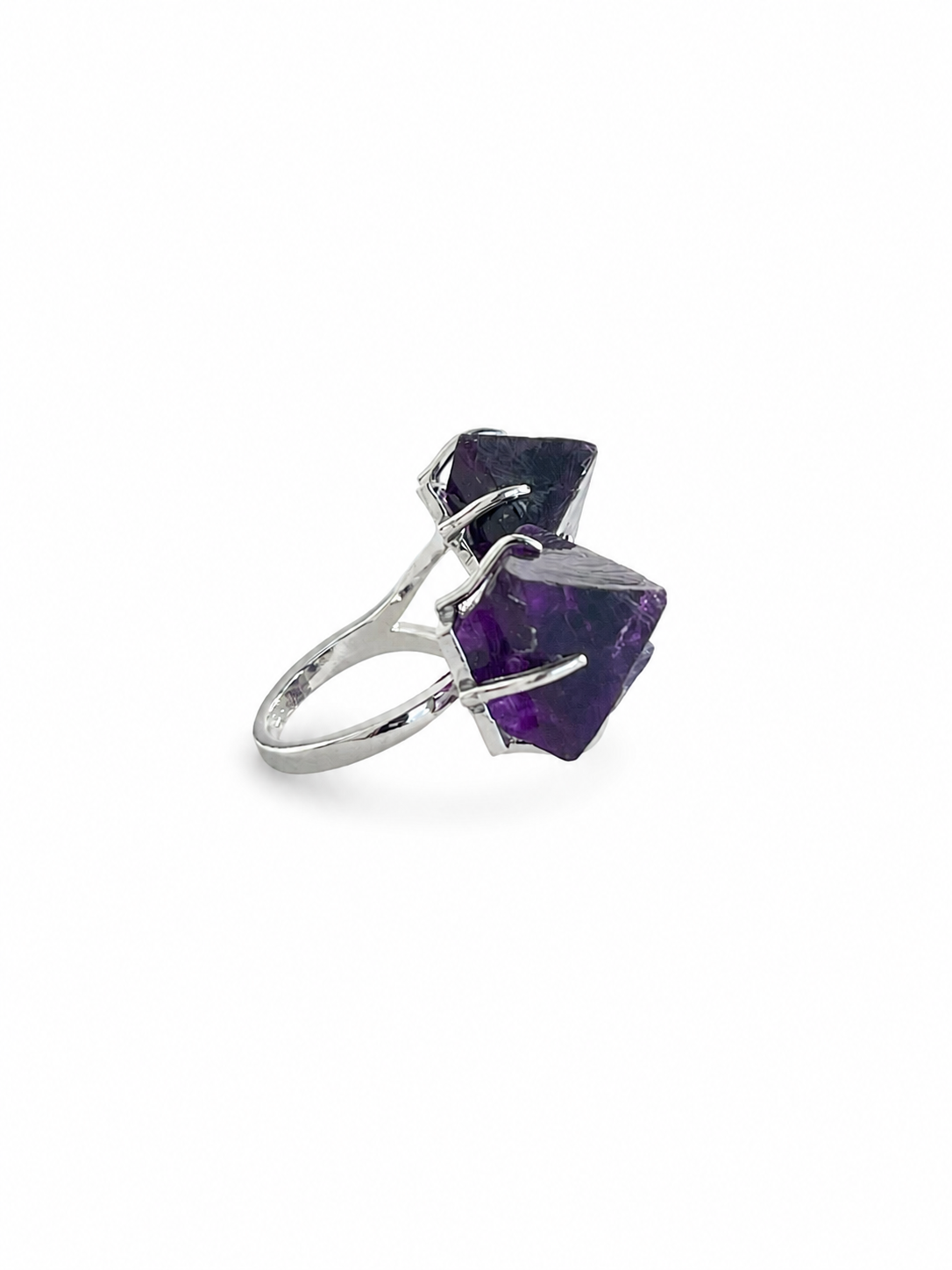 Side view of purple octahedral fluorite ring with silver tone band
