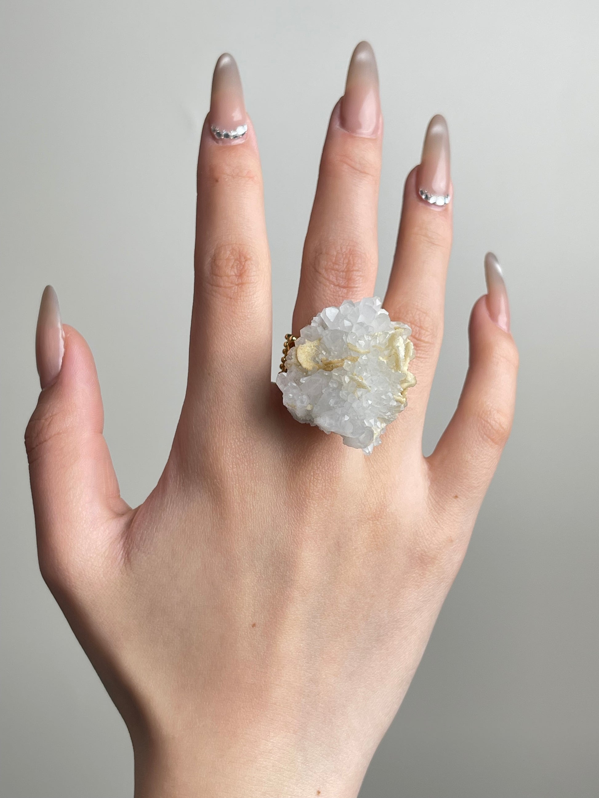 Quartz Cluster with Calcite Ring worn on hand