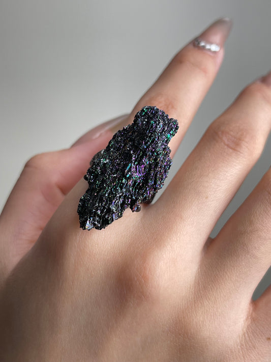 Rainbow Carborundum Ring close-up worn on hand