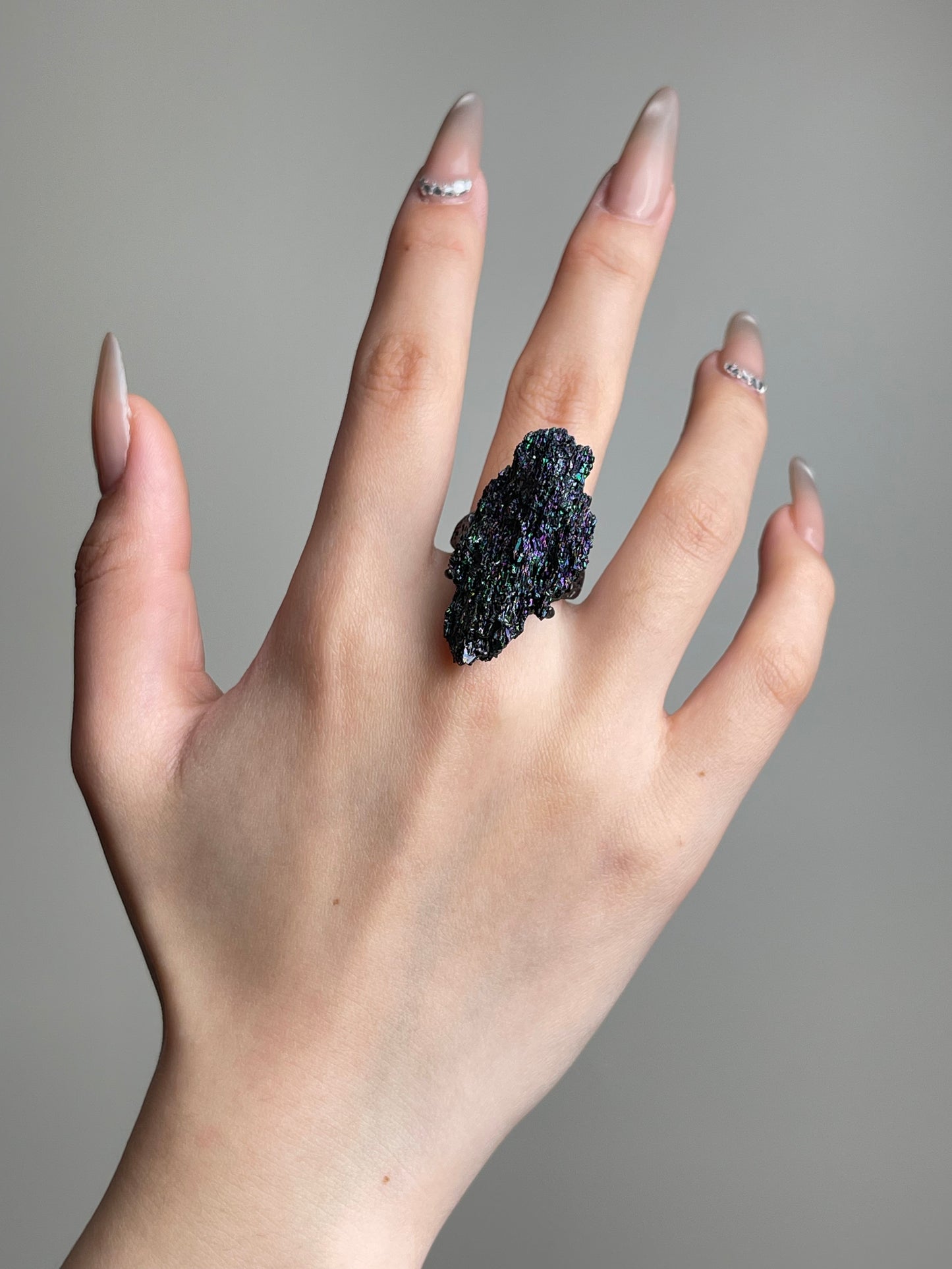 Rainbow Carborundum Ring worn on hand