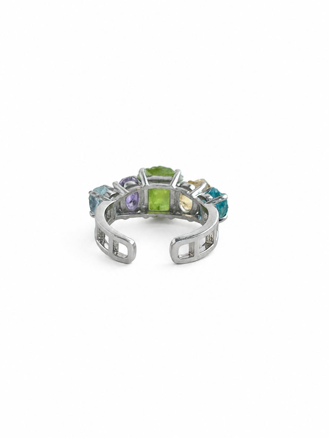 Back view of rainbow raw crystal ring with adjustable band