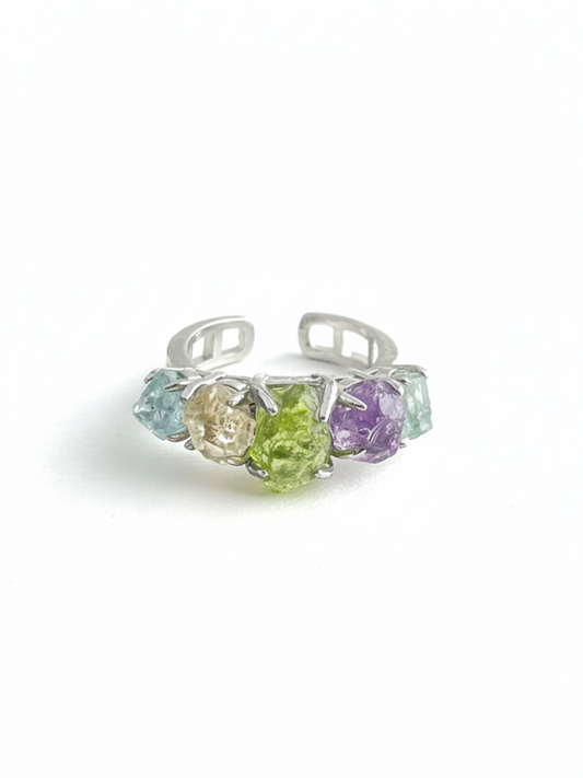 Rainbow raw crystal ring front view, natural aquamarine, citrine, peridot, amethyst and blue apatite set in gold band, colorful unique crystal ring