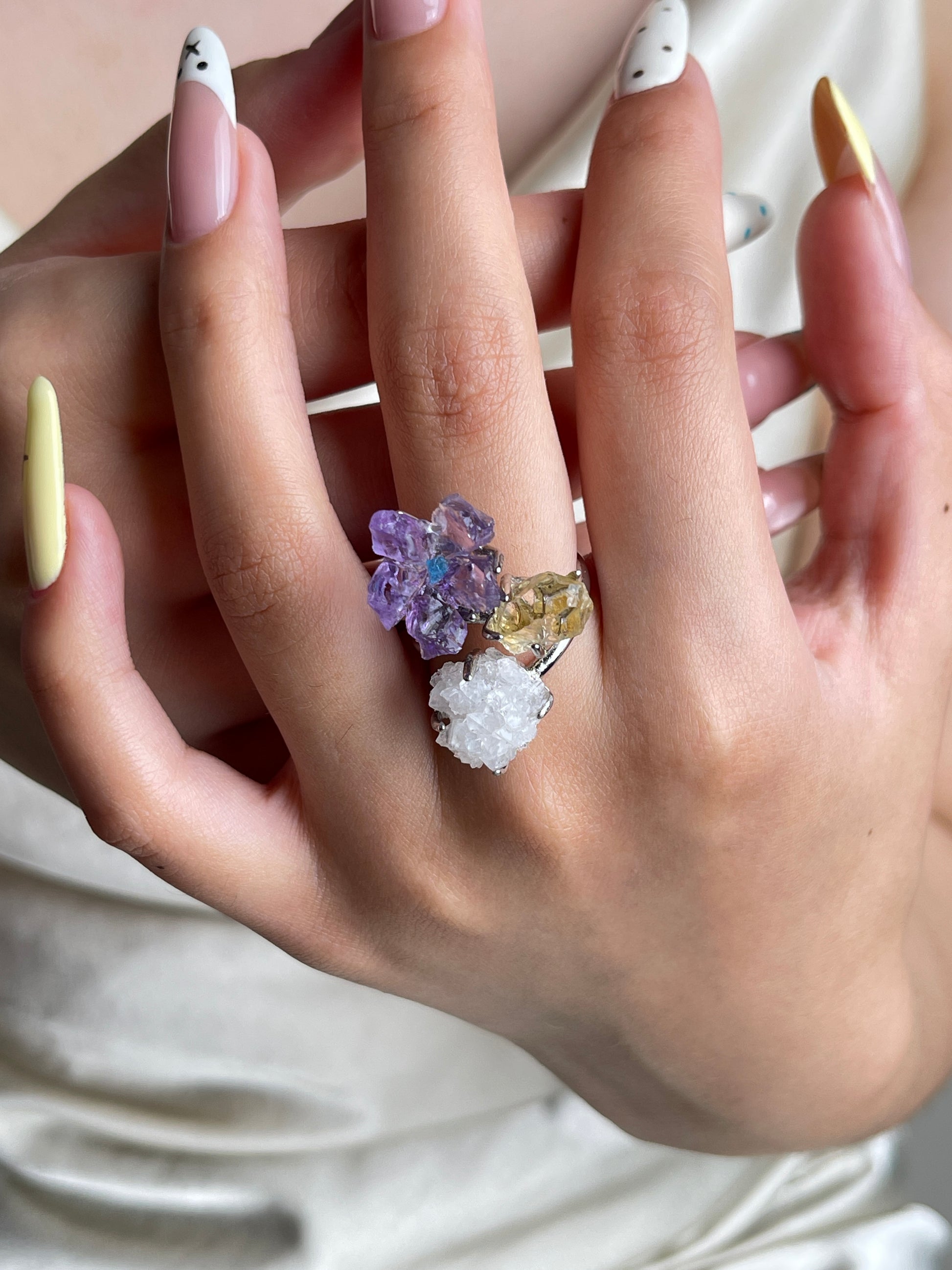 Raw amethyst flower, blue apatite, citrine and apophyllite crystal ring worn on hand