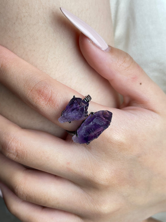 Close-up hand wearing raw Brazilian Amethyst crystal ring