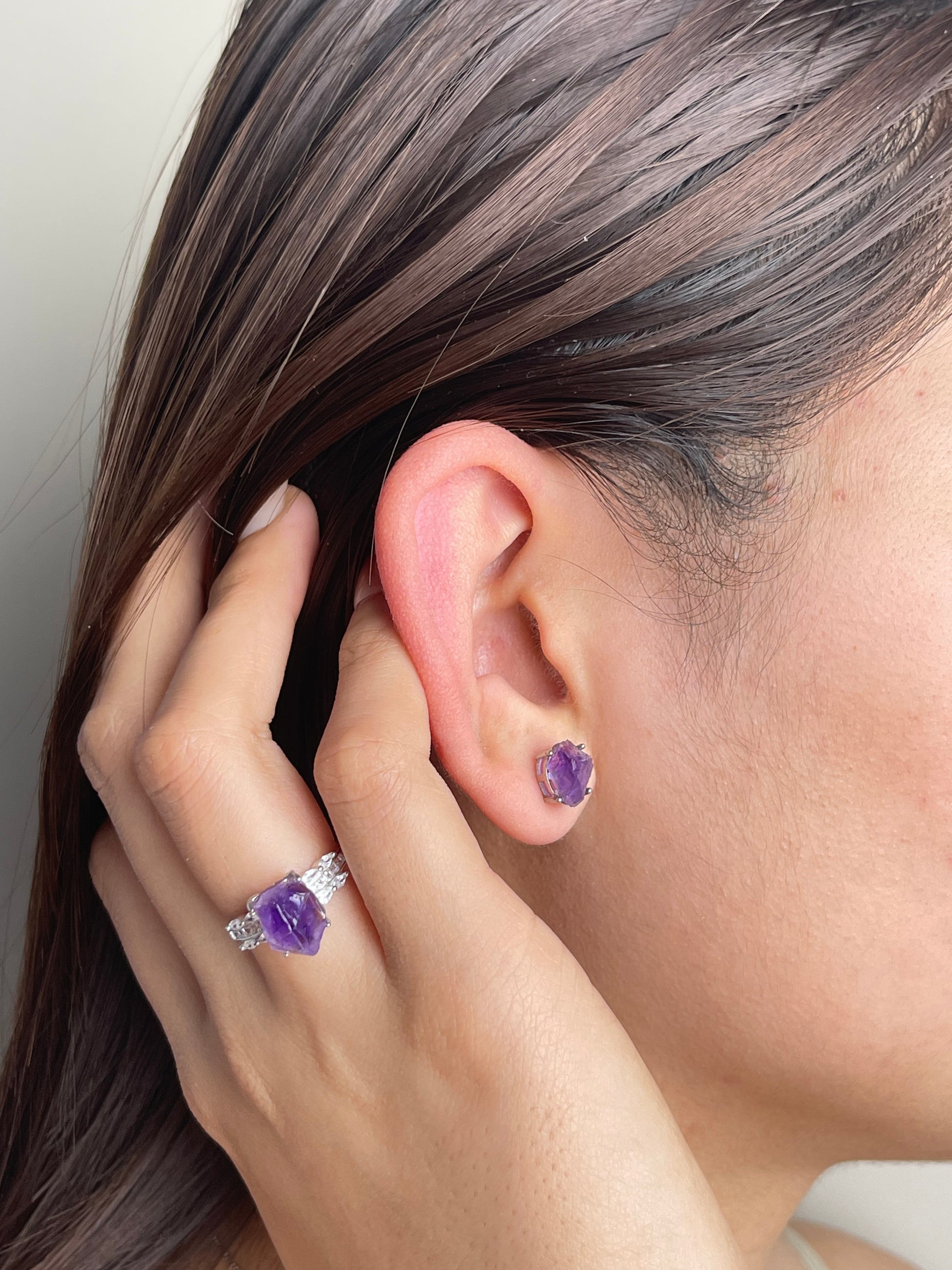 Raw Amethyst Stud Earrings worn on ear