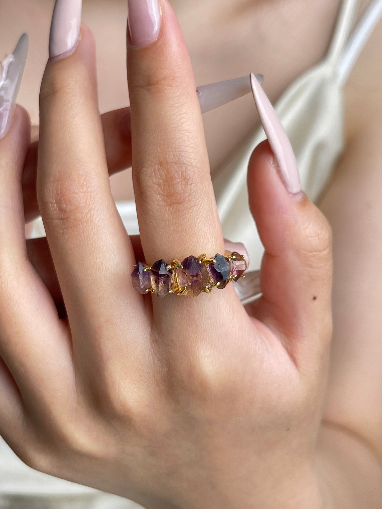 Raw Amethyst Super Seven crystal band ring worn on hand