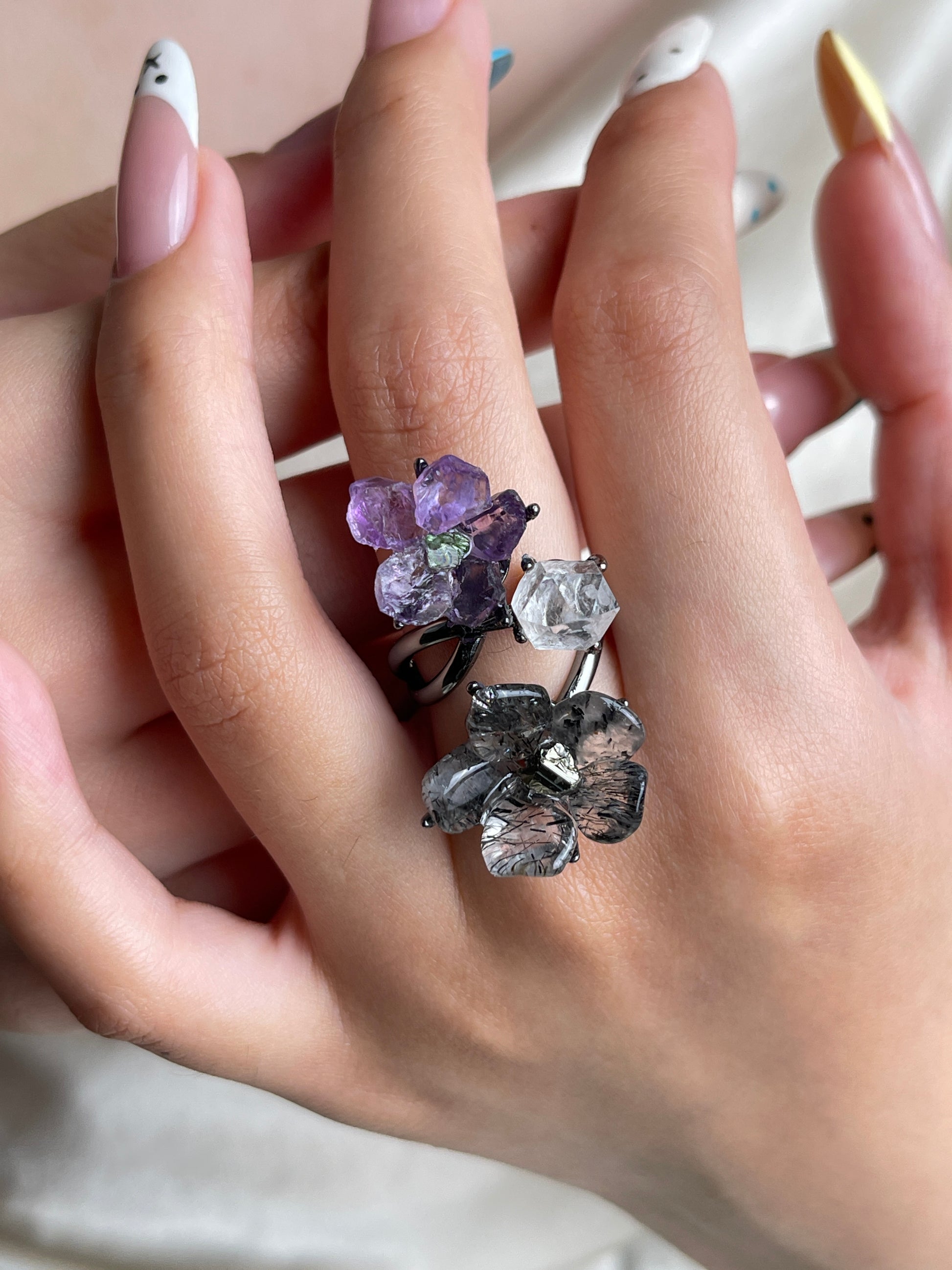 Raw amethyst, tourmalinated quartz and Herkimer Diamond Quartz crystal garden ring worn on hand