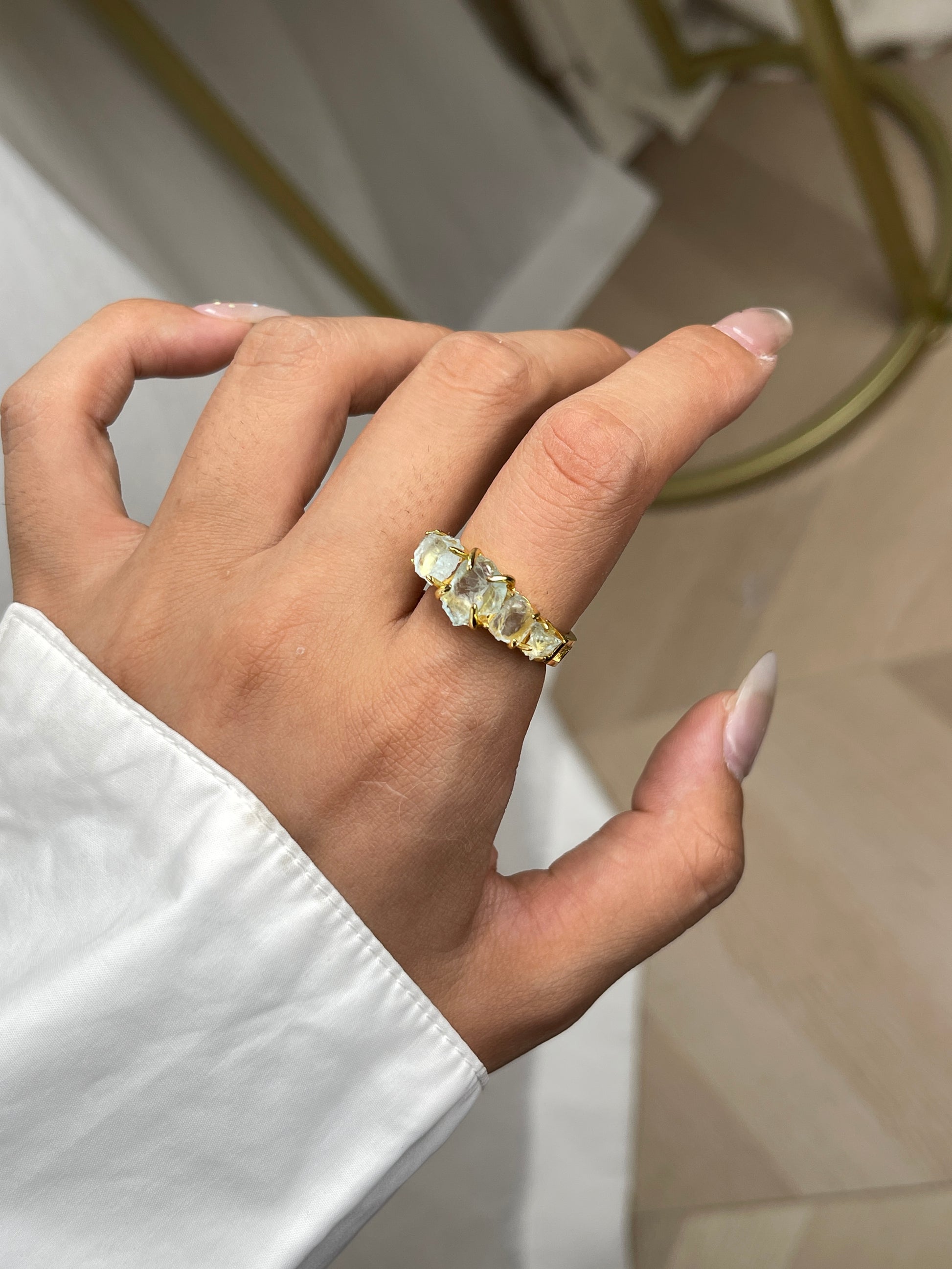 Close-up hand shot of Raw Aquamarine Band Ring by Oryssia