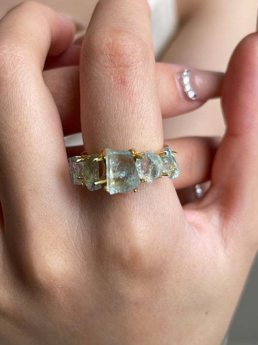 Close-up hand shot of Raw Aquamarine Band Ring by Oryssia