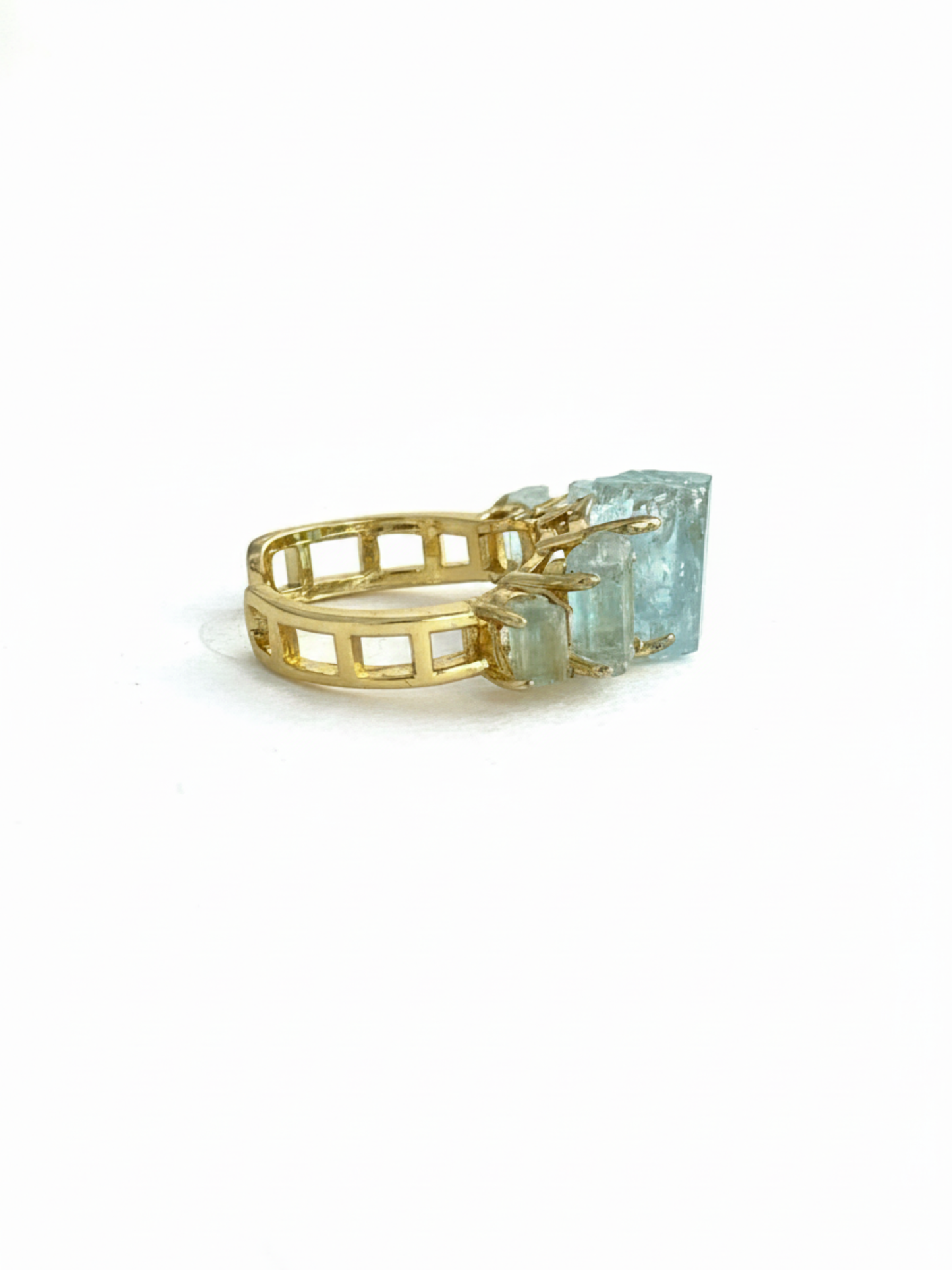 Side view of raw Aquamarine crystal band ring with gold plated setting