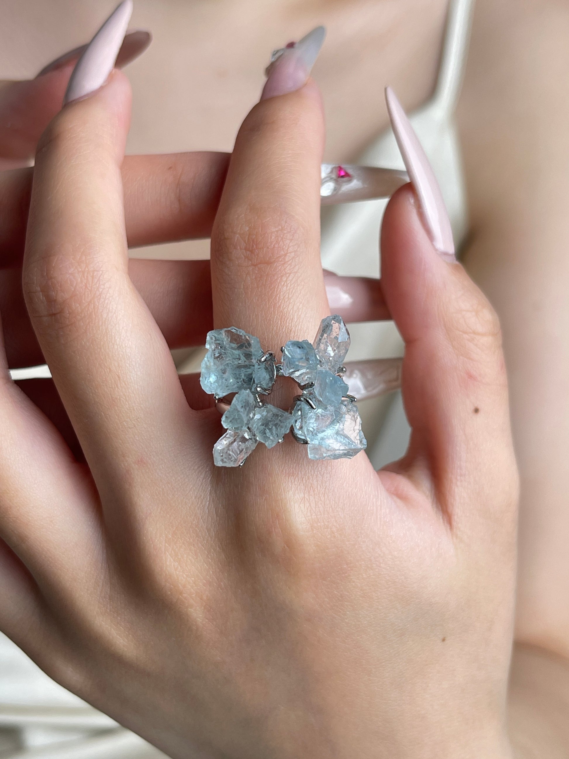 Raw Aquamarine and Herkimer Diamond Quartz flower ring worn on hand