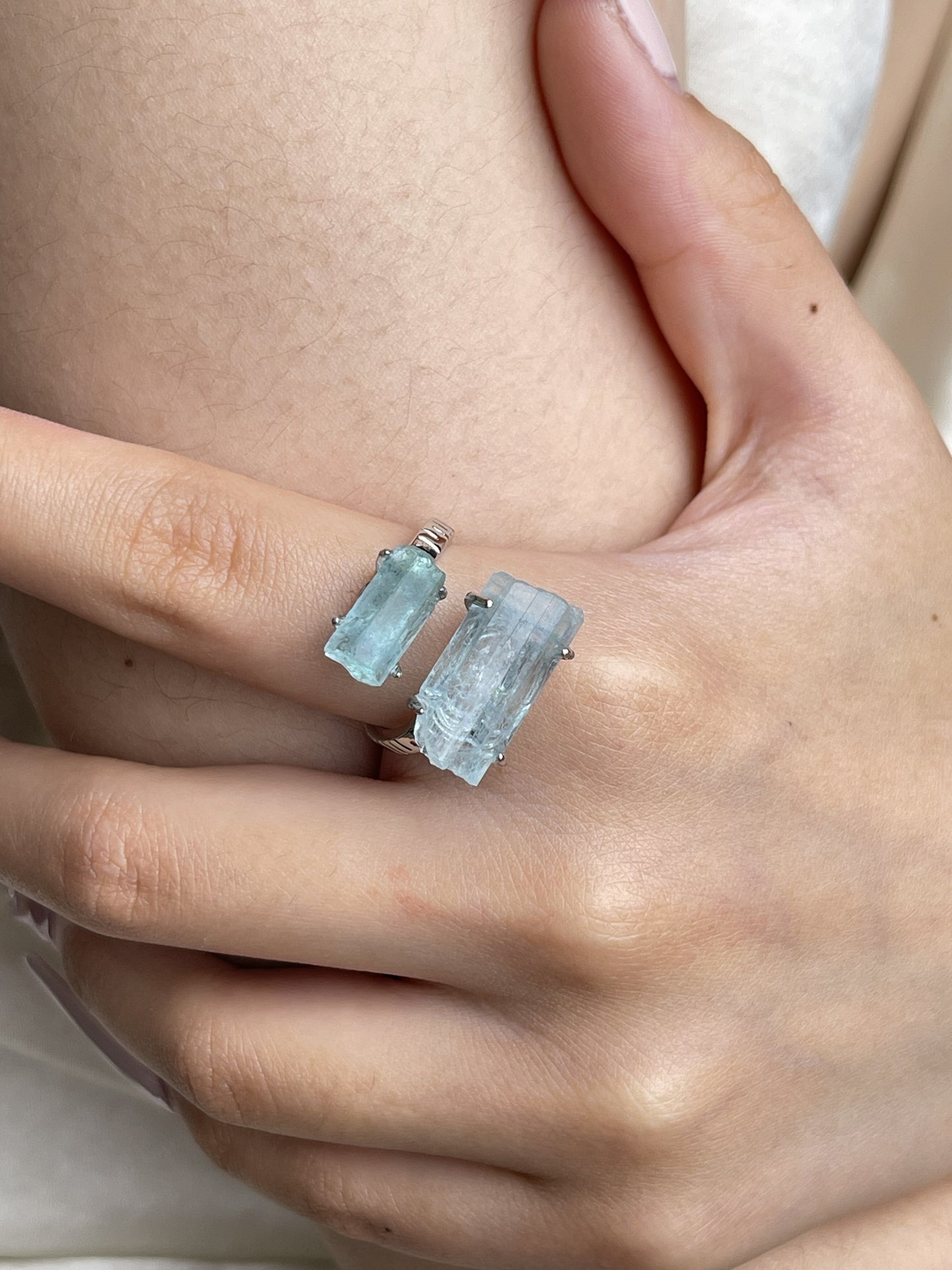 Close-up hand view of raw Aquamarine hexagonal crystal ring from Pakistan