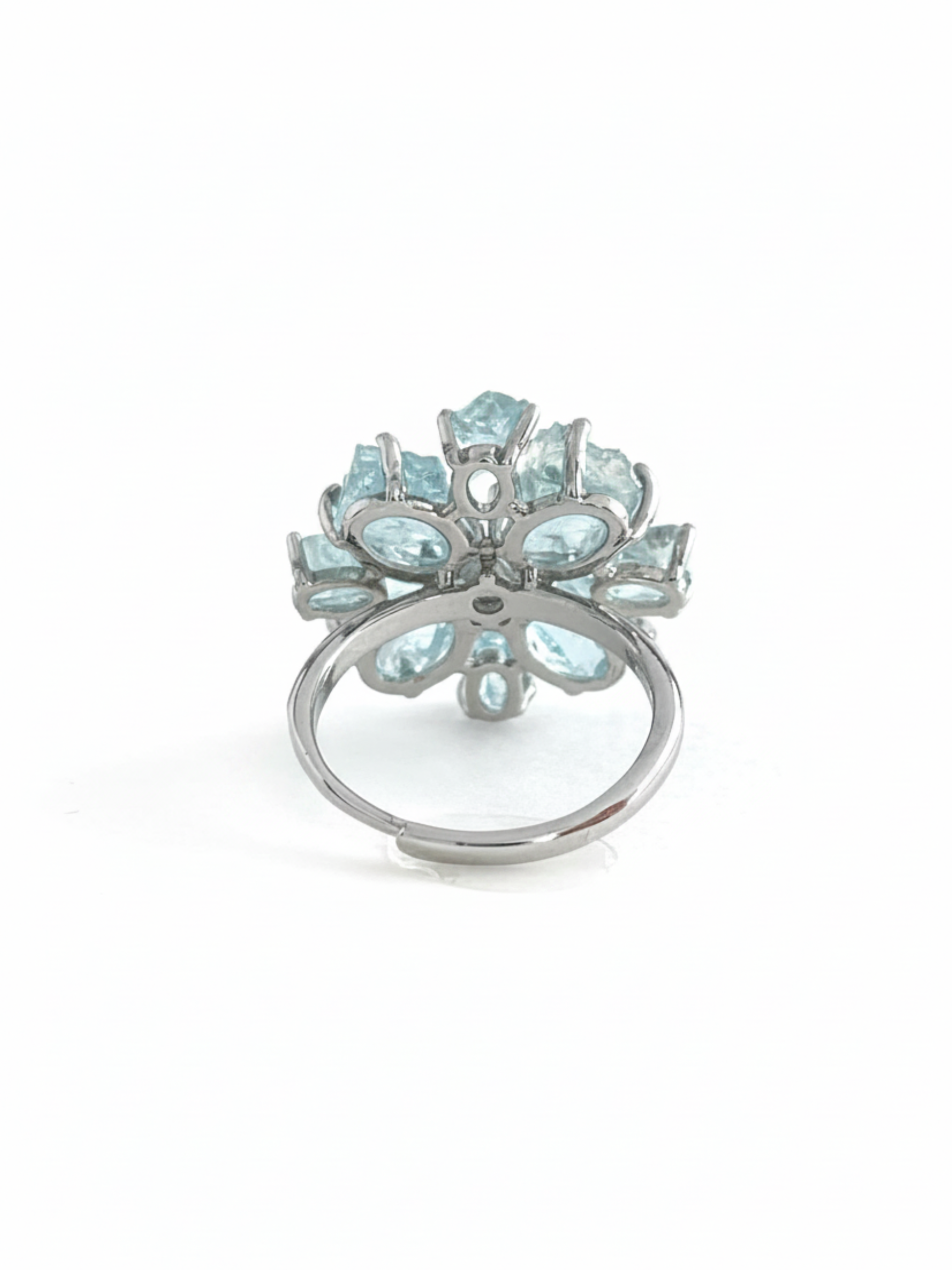 Back view of raw aquamarine snowflake ring showing the adjustable open band and crystal setting