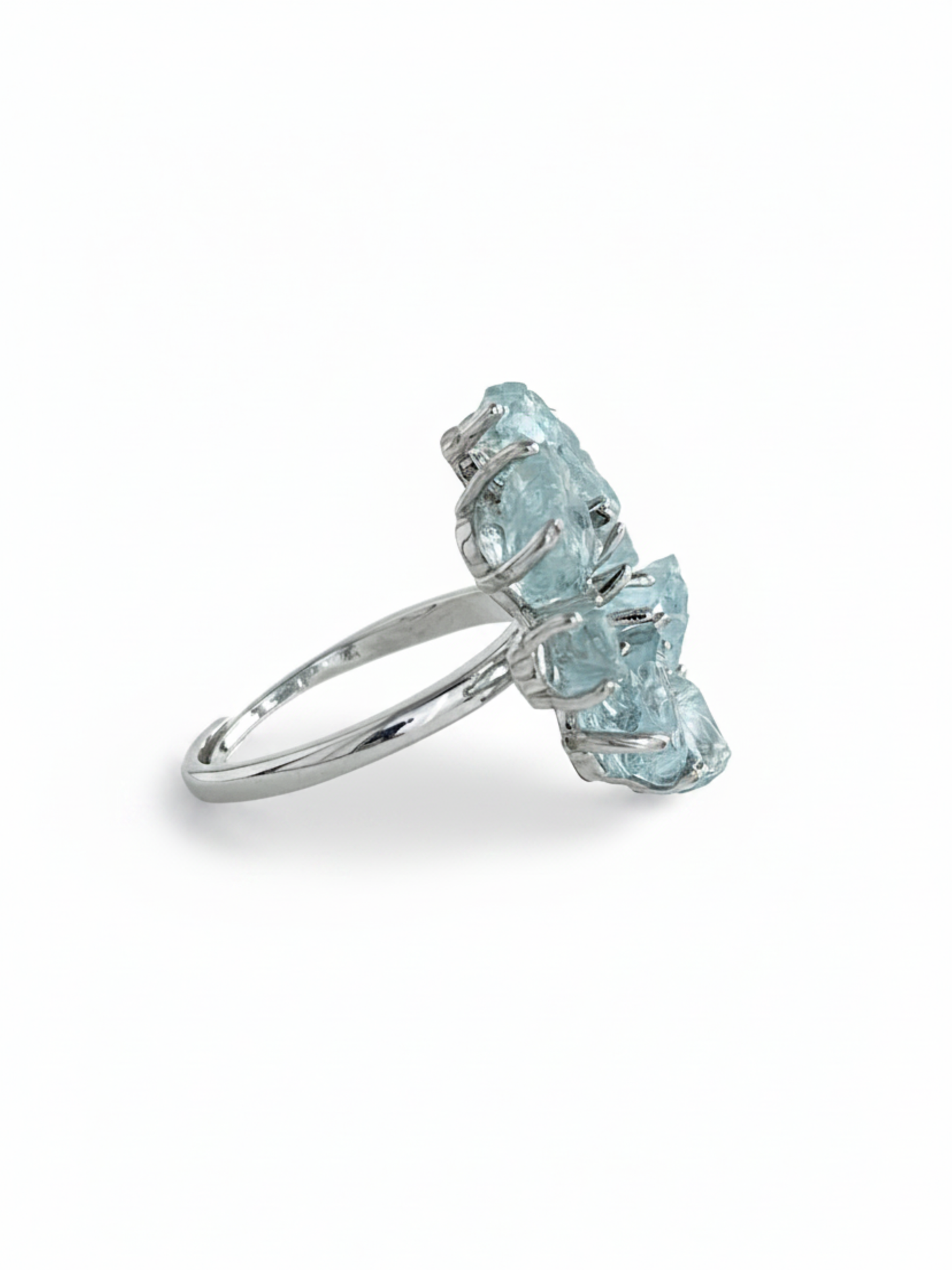 Side view of raw aquamarine snowflake ring showing crystal height and silver tone ring setting