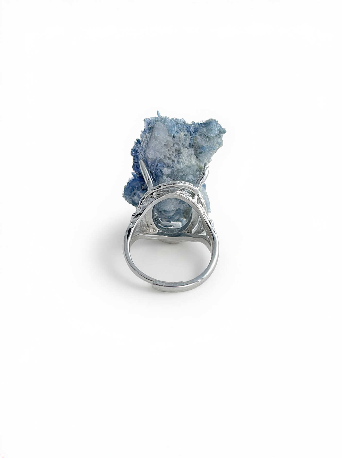 Back view of a raw Blue Sapphire crystal ring.