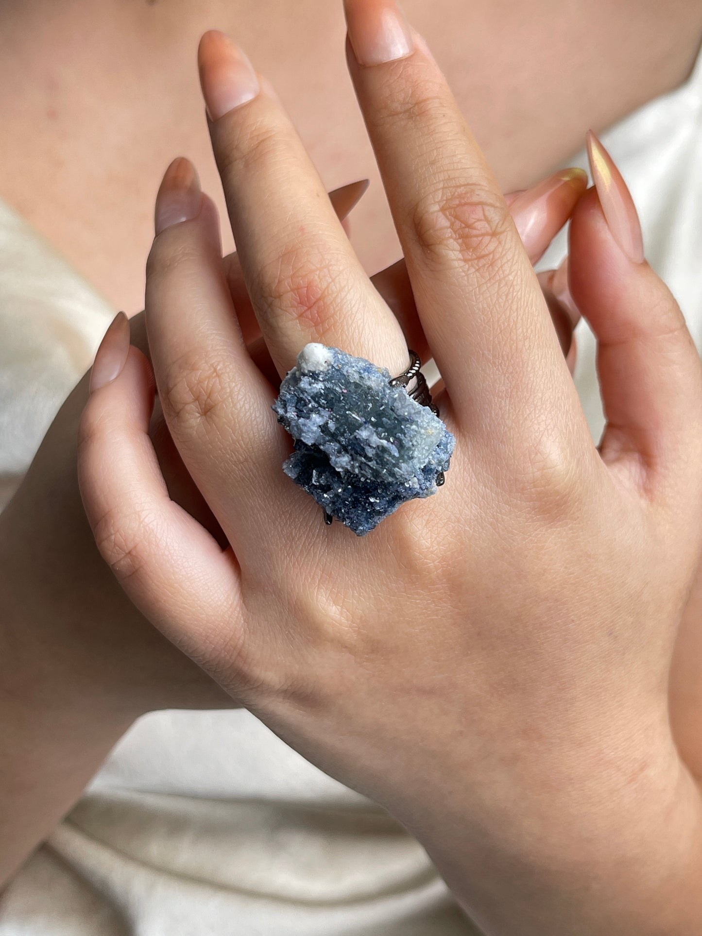 Raw Blue Sapphire Crystal Ring worn on hand
