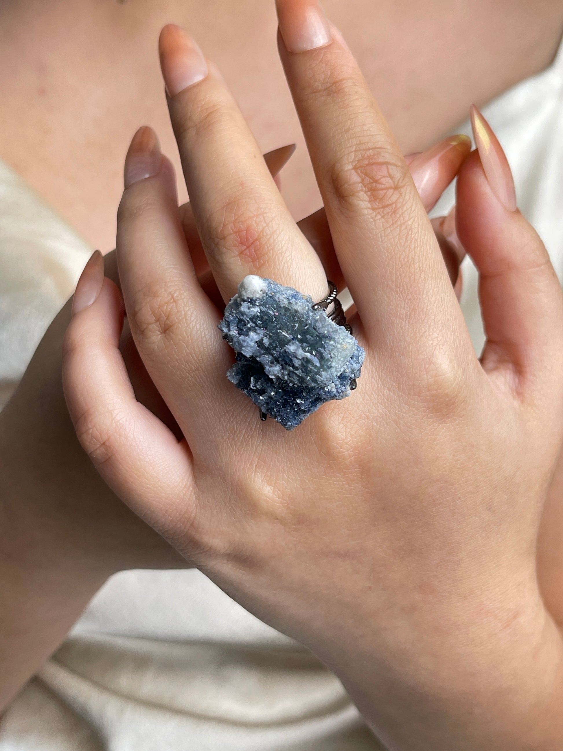 Raw Blue Sapphire Crystal Ring worn on hand