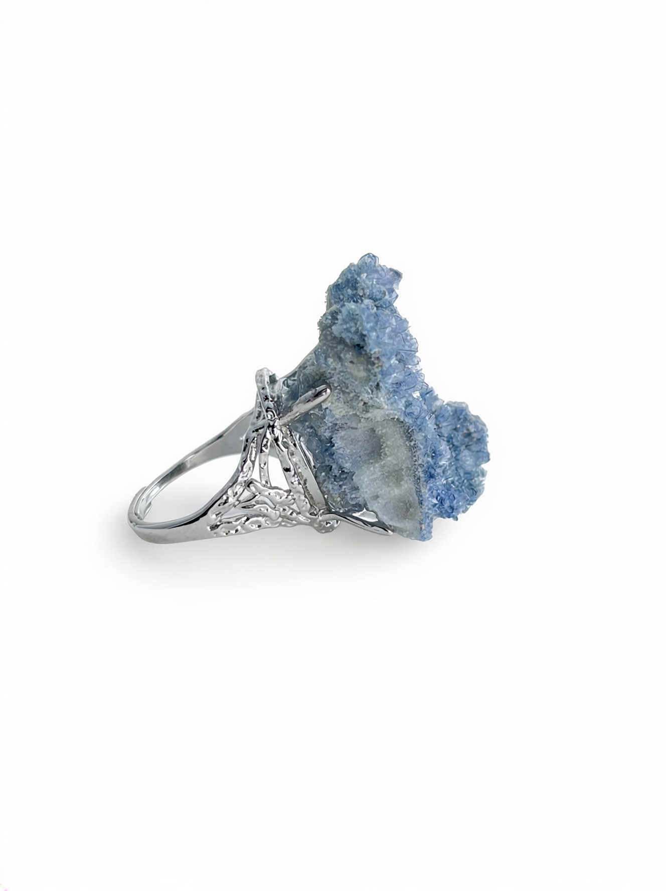 Side view of a raw Blue Sapphire crystal ring.