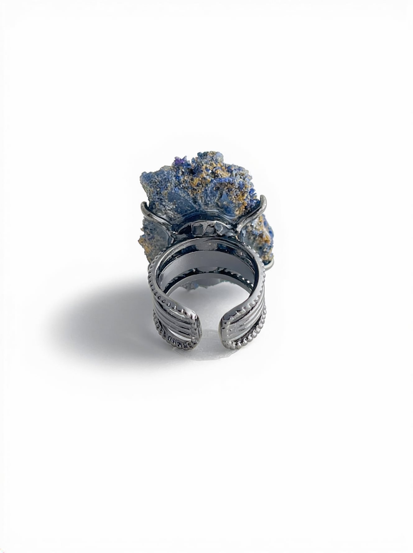 Back view of a raw Blue Sapphire mineral specimen ring.