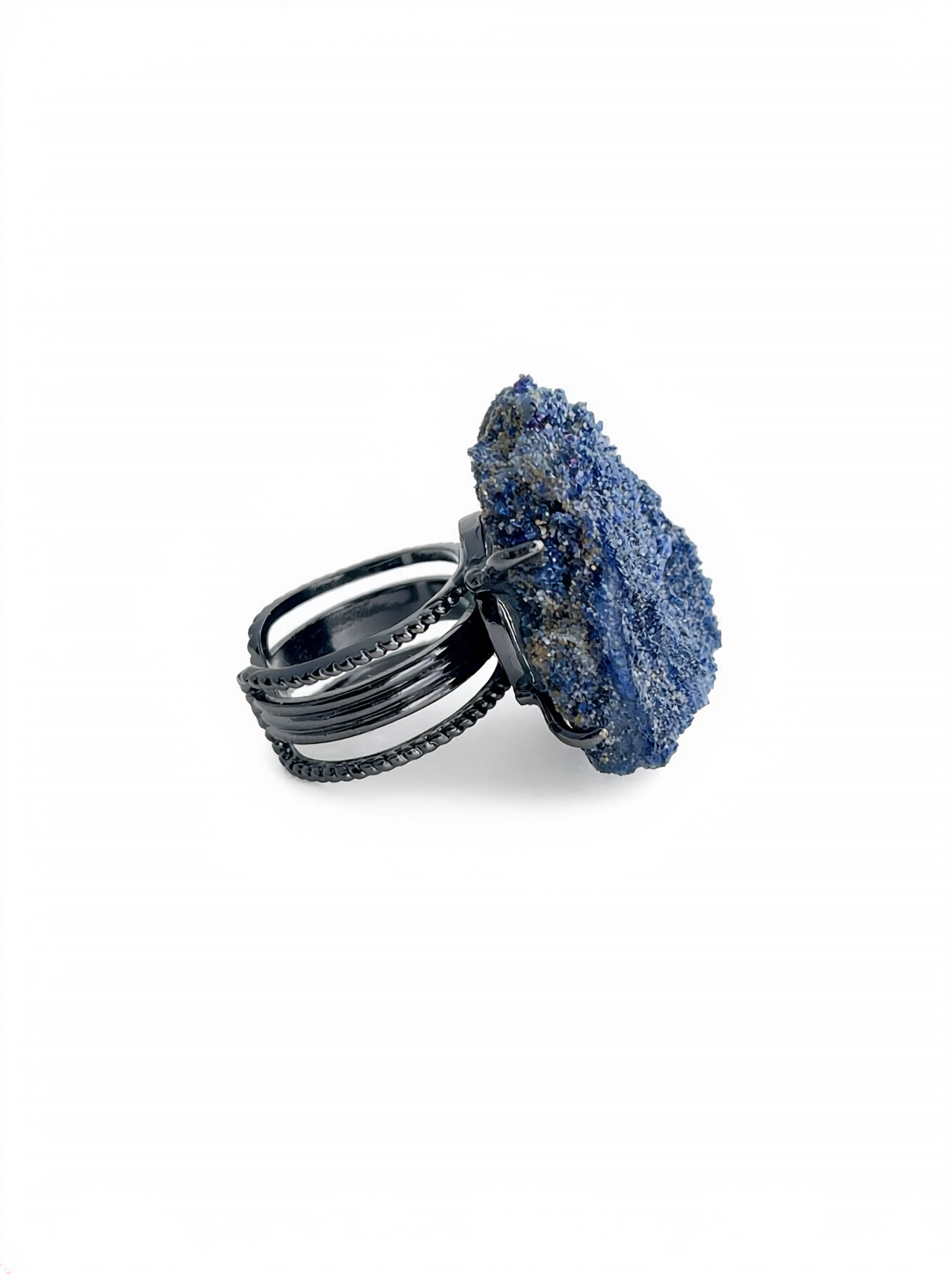 Side view of a raw Blue Sapphire mineral specimen ring.