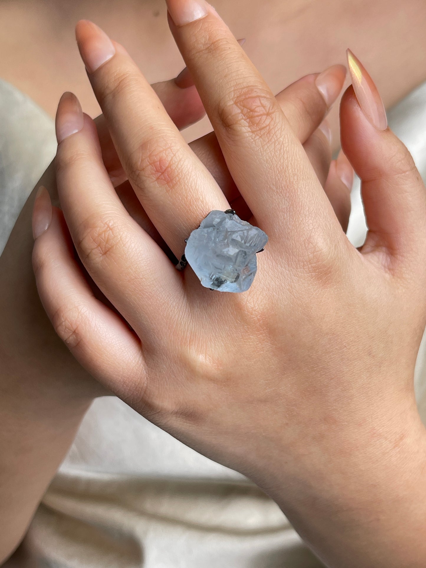 Raw Celestite Crystal Ring from Madagascar worn on hand