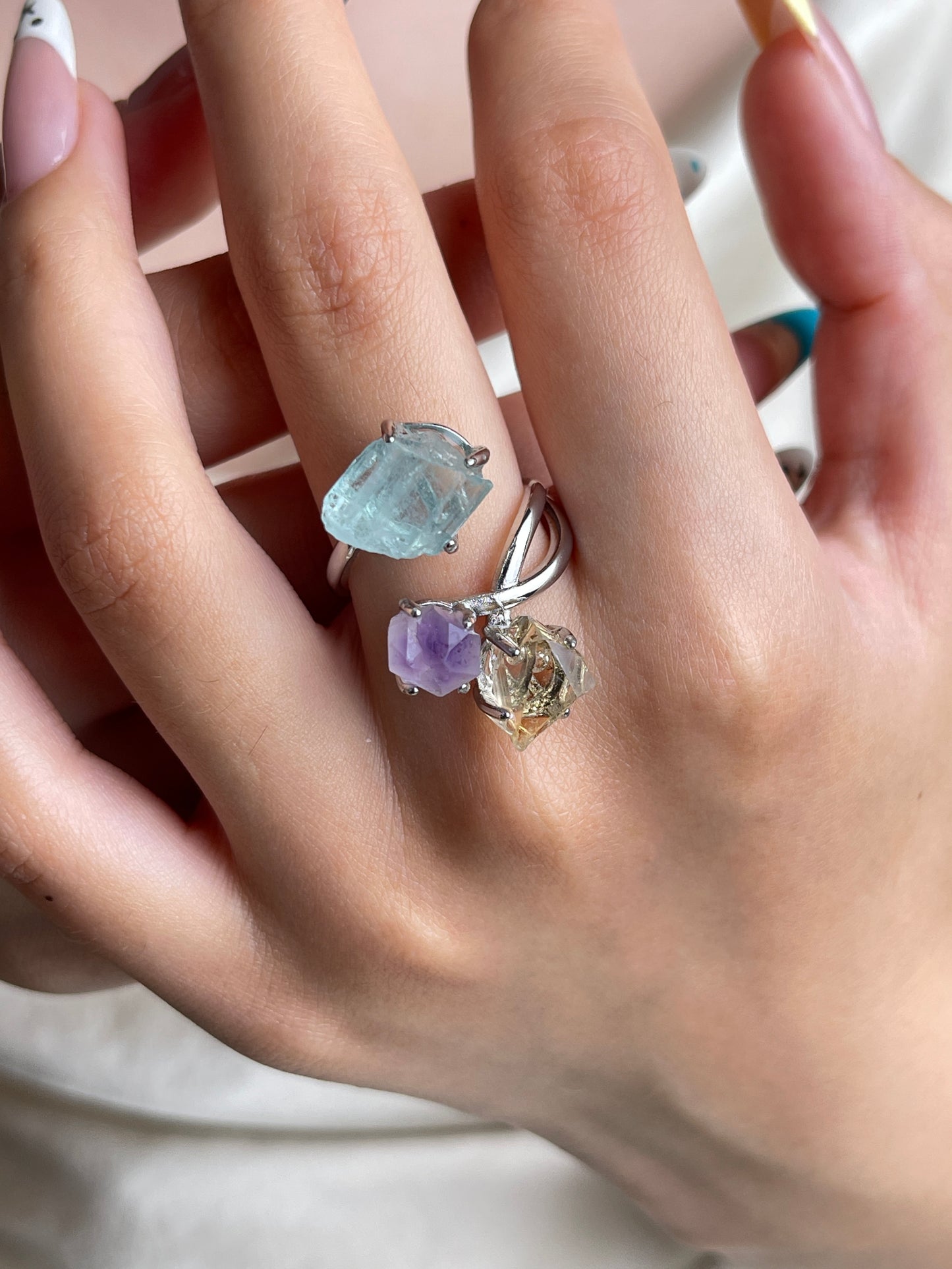 Raw citrine, raw amethyst and raw aquamarine crystal ring worn on hand
