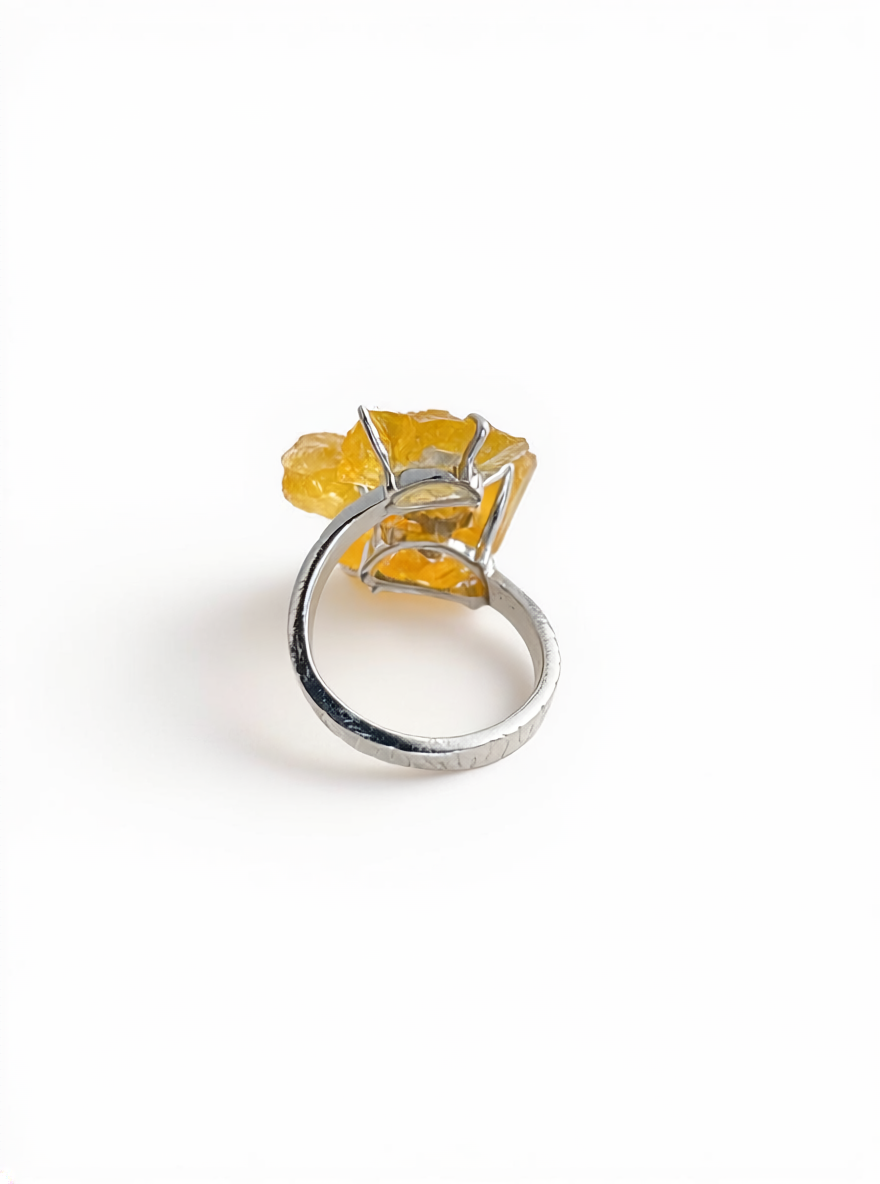 Back view of raw citrine flower ring with chalcopyrite