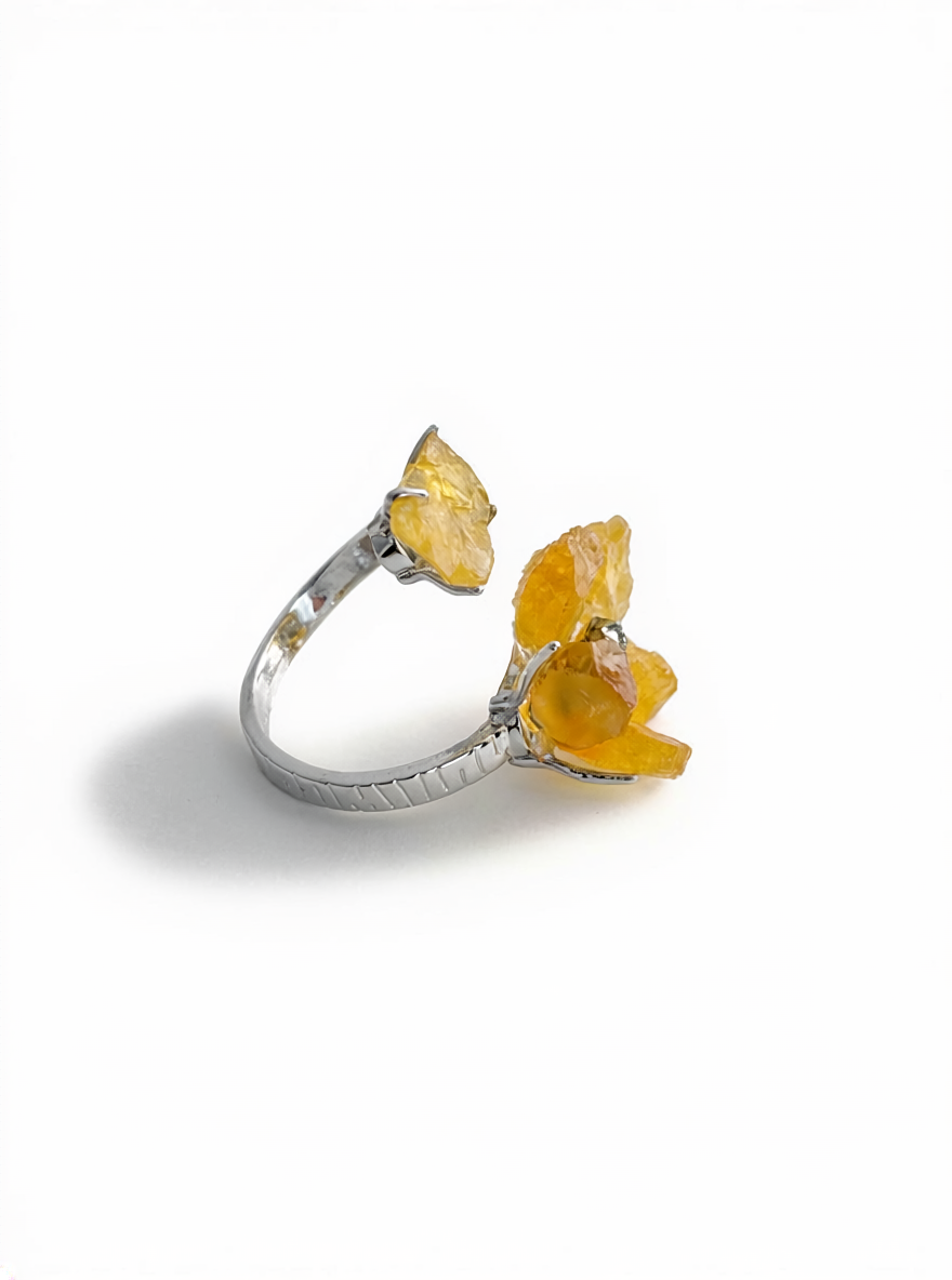 Side view of raw citrine flower ring with chalcopyrite