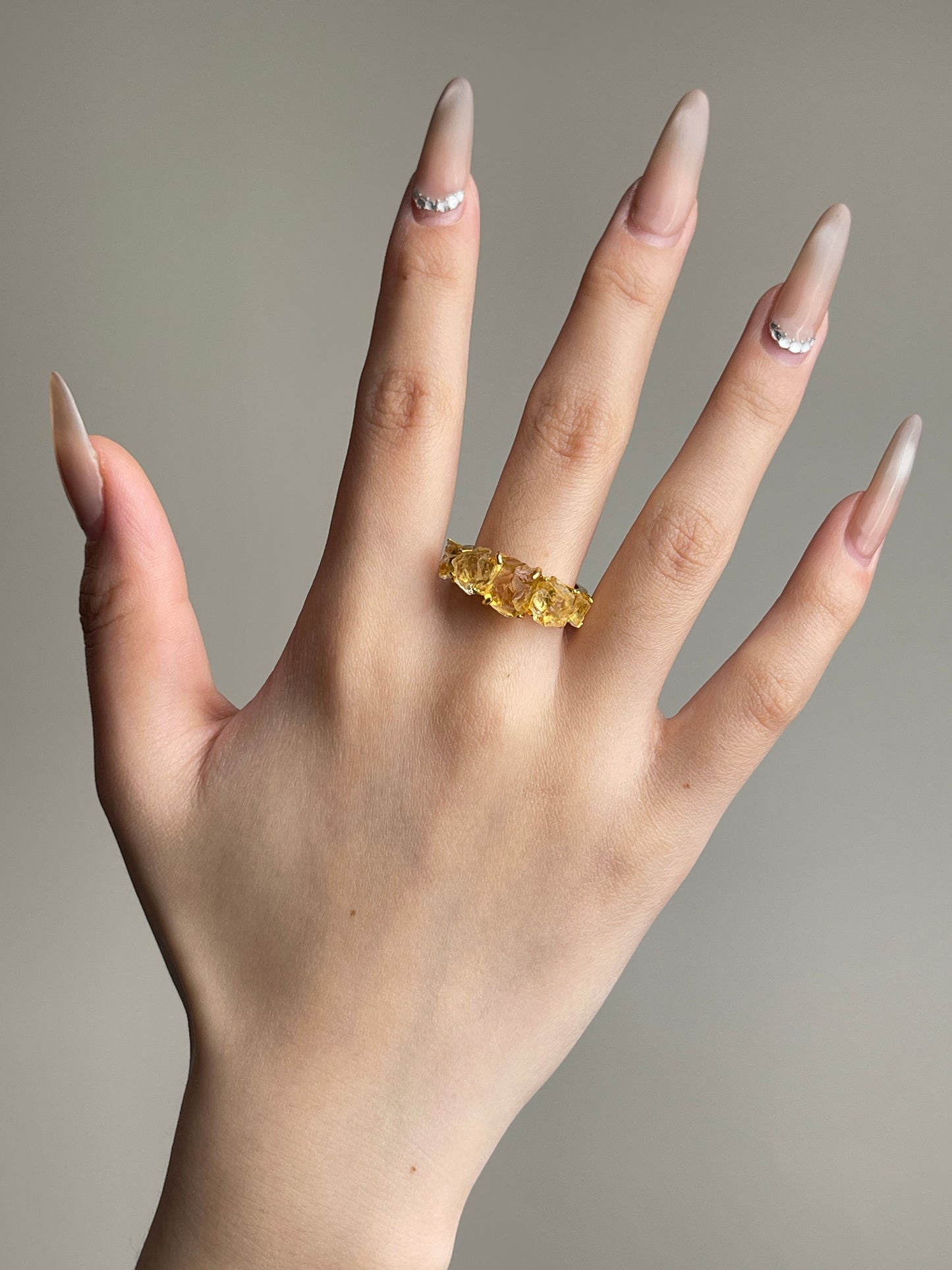 Raw Citrine row ring worn on hand
