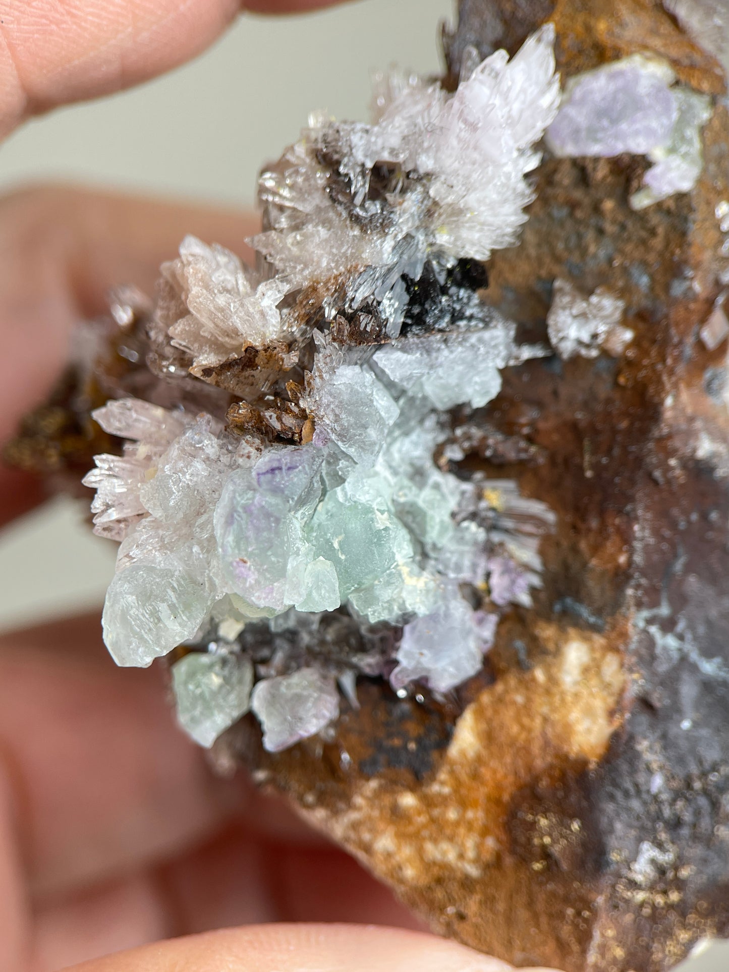 Detail of delicate acicular Creedite crystals growing on natural matrix
