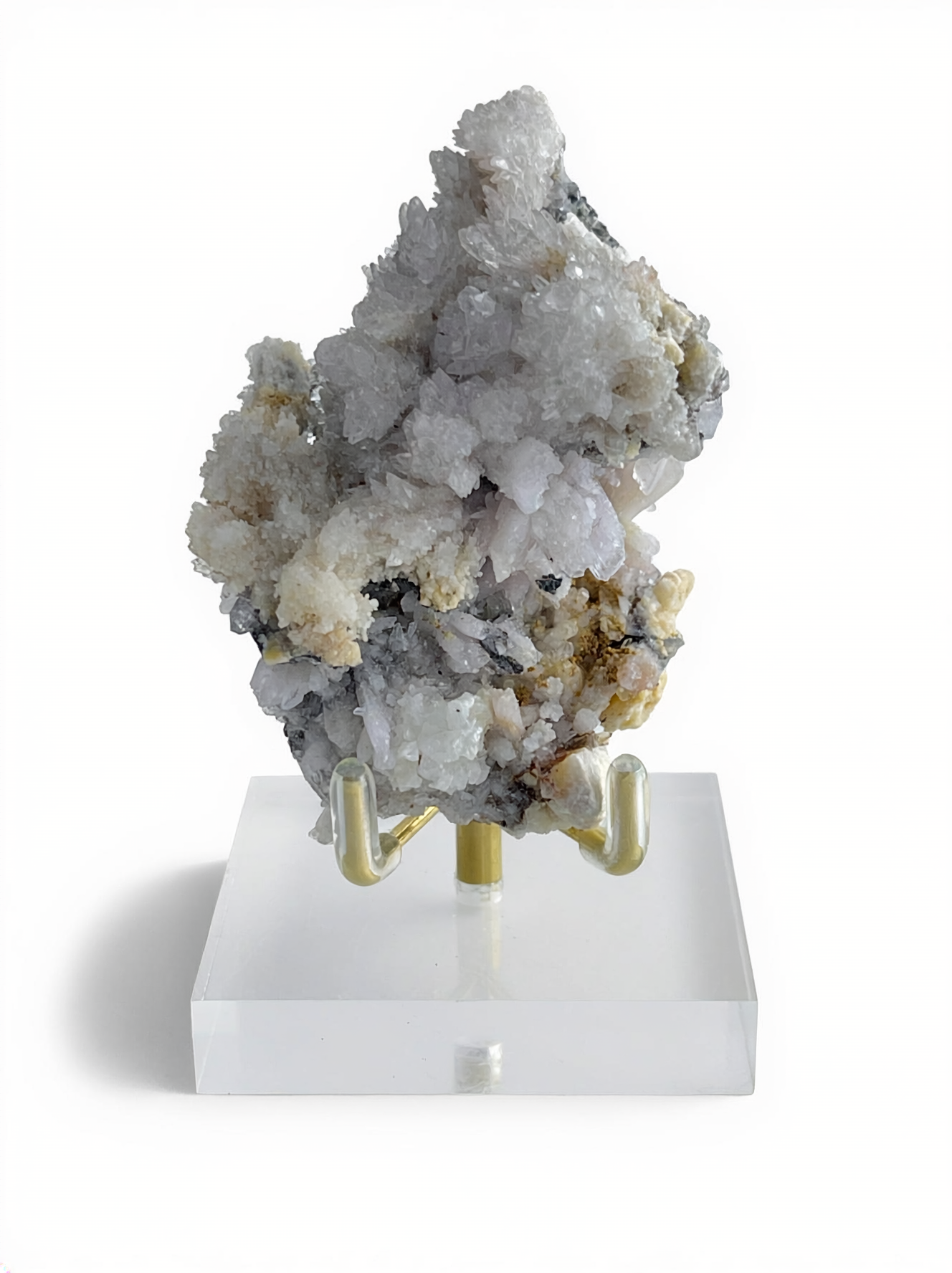 Raw Creedite cluster mineral specimen on matrix with display stand