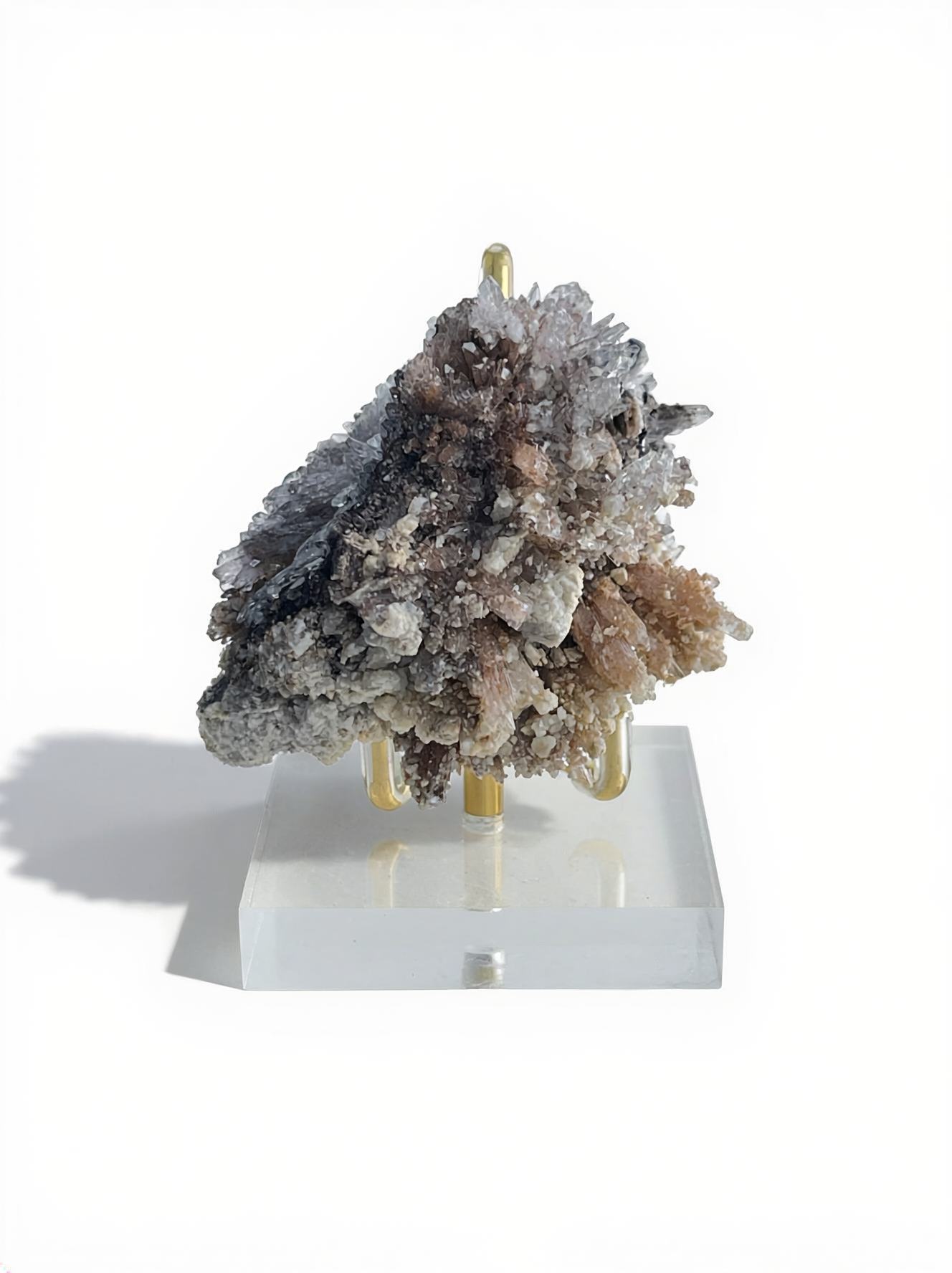 Raw Creedite cluster mineral specimen on matrix with display stand
