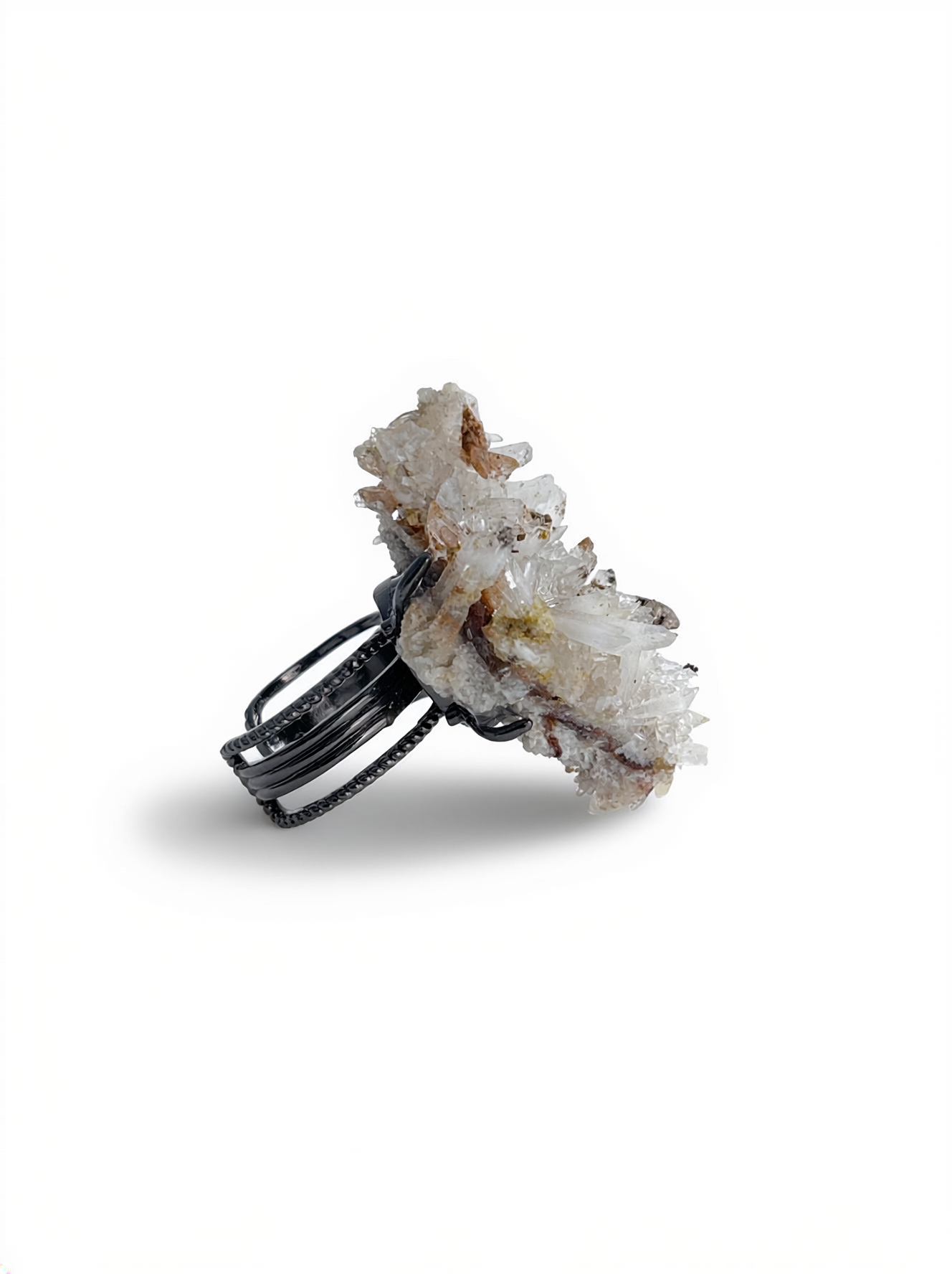 Side view of a raw Creedite crystal cluster ring.