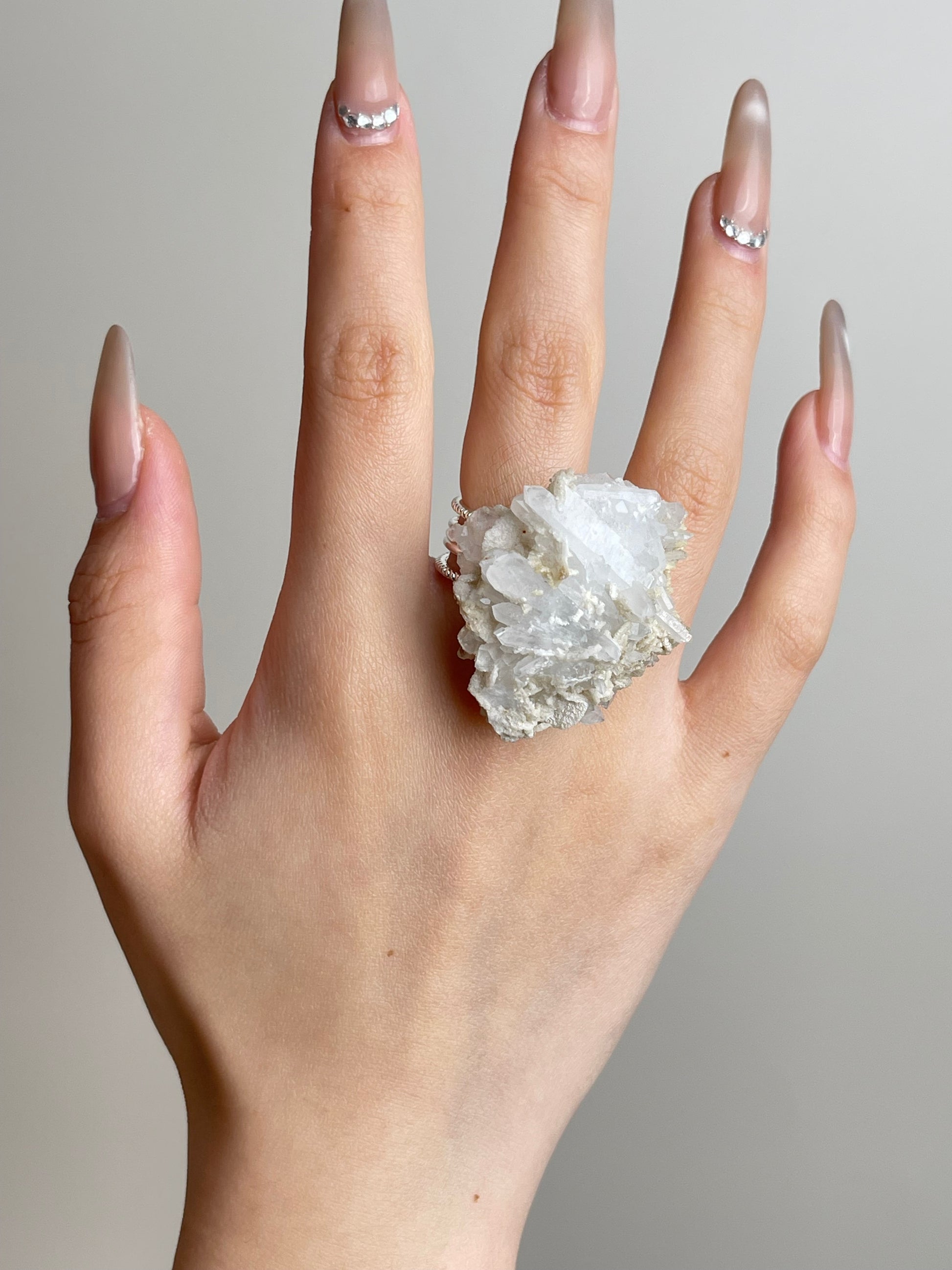 Raw creedite crystal cluster ring worn