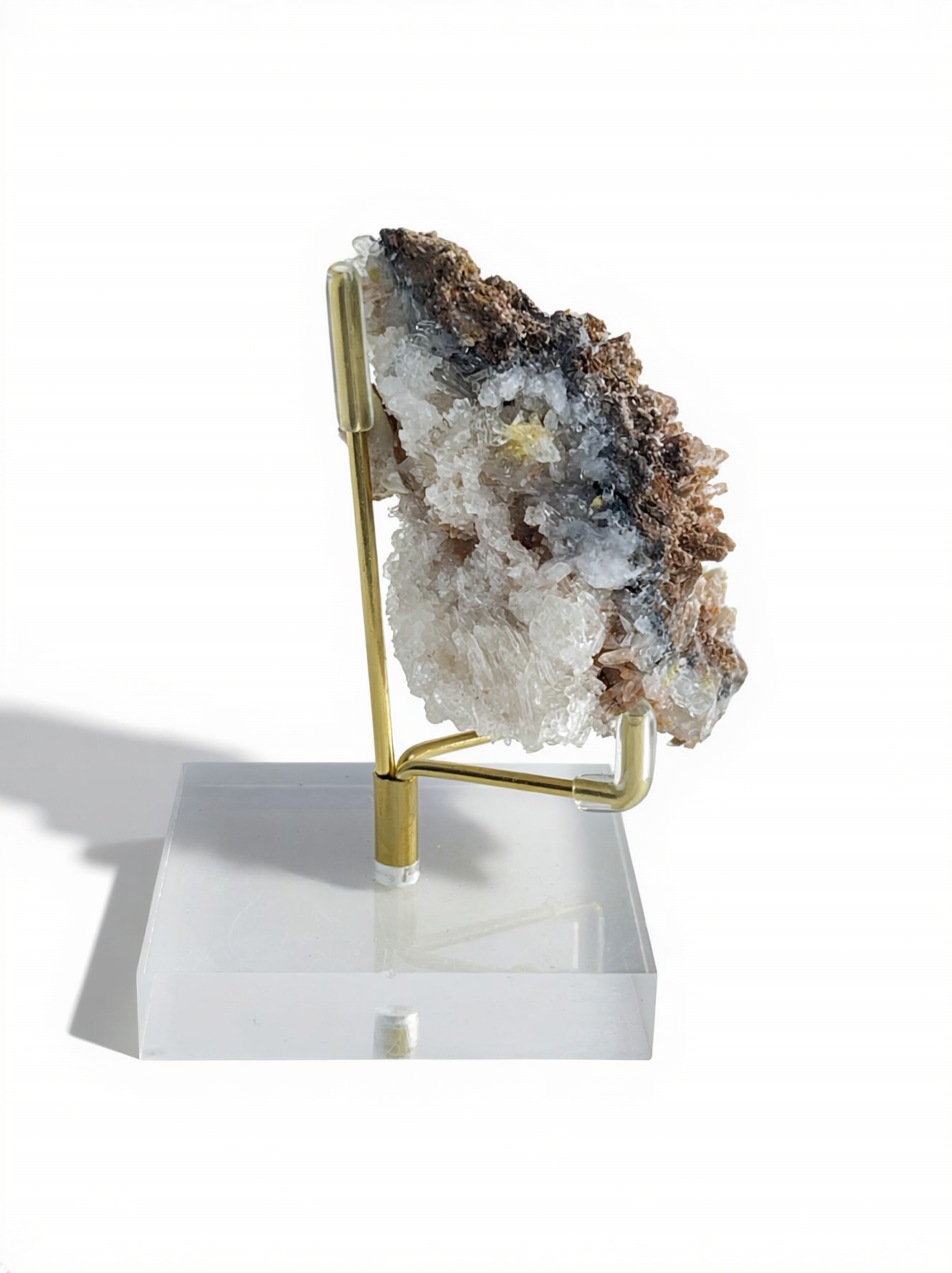 Angled side view of Creedite crystal pocket growing on natural matrix
