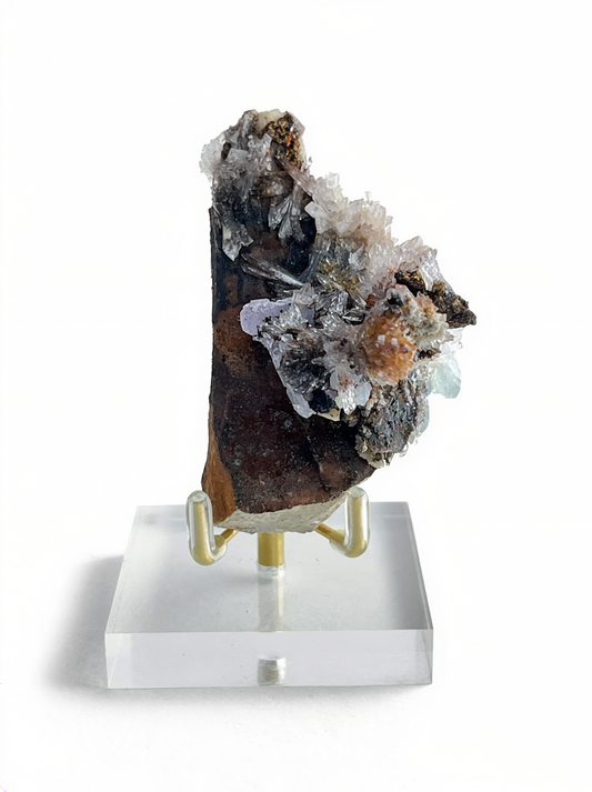 Raw Creedite flower mineral specimen on matrix with display stand