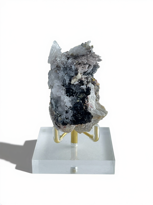 Raw Creedite flower mineral specimen on dark matrix with display stand