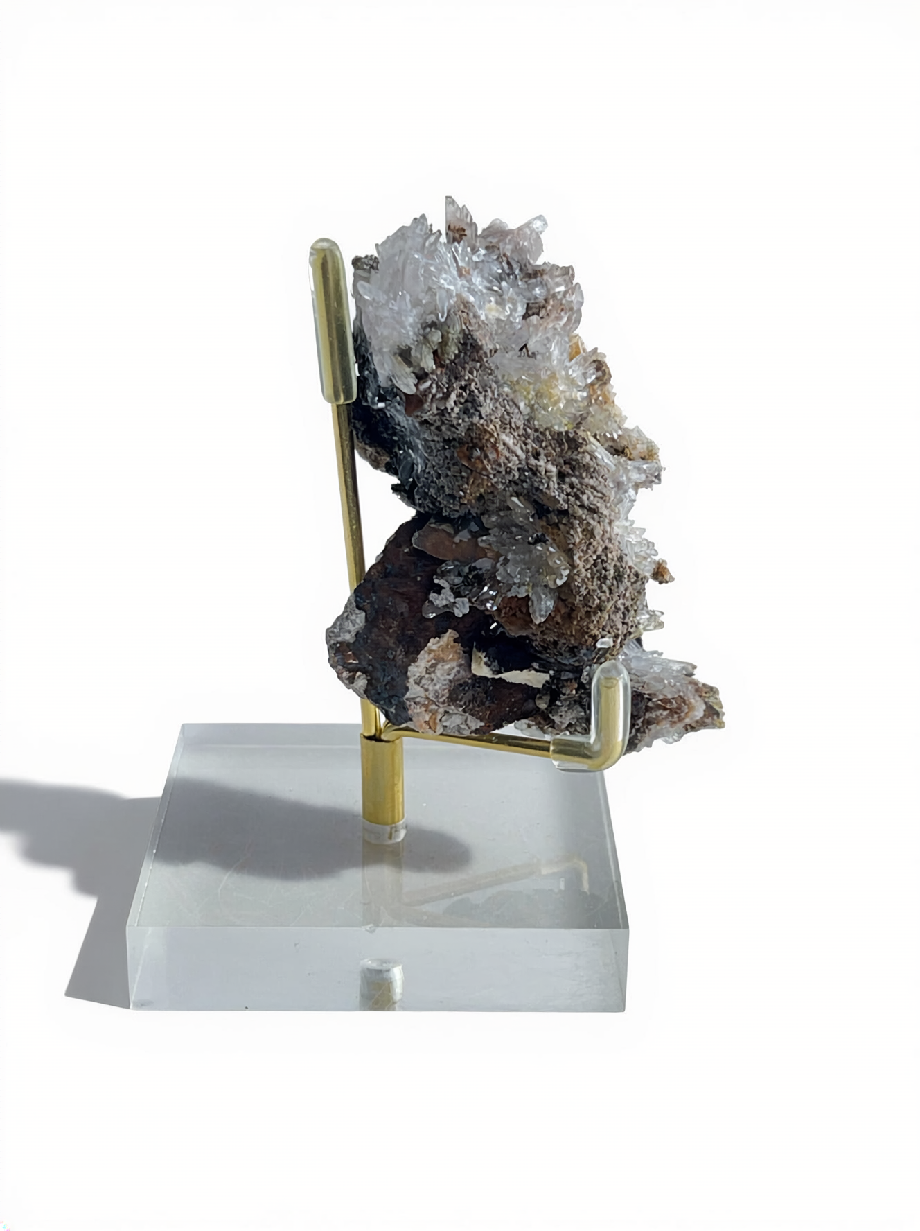 Side view of Raw Creedite flower mineral specimen on matrix