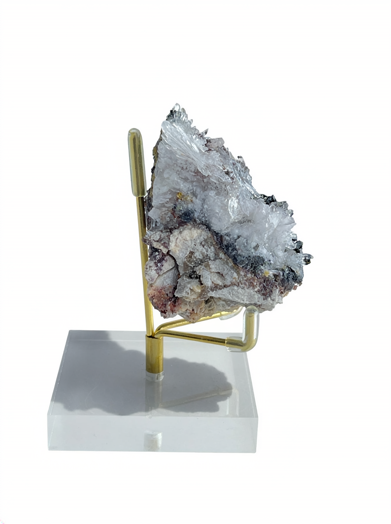 Side view of Raw Creedite flower mineral specimen on natural matrix