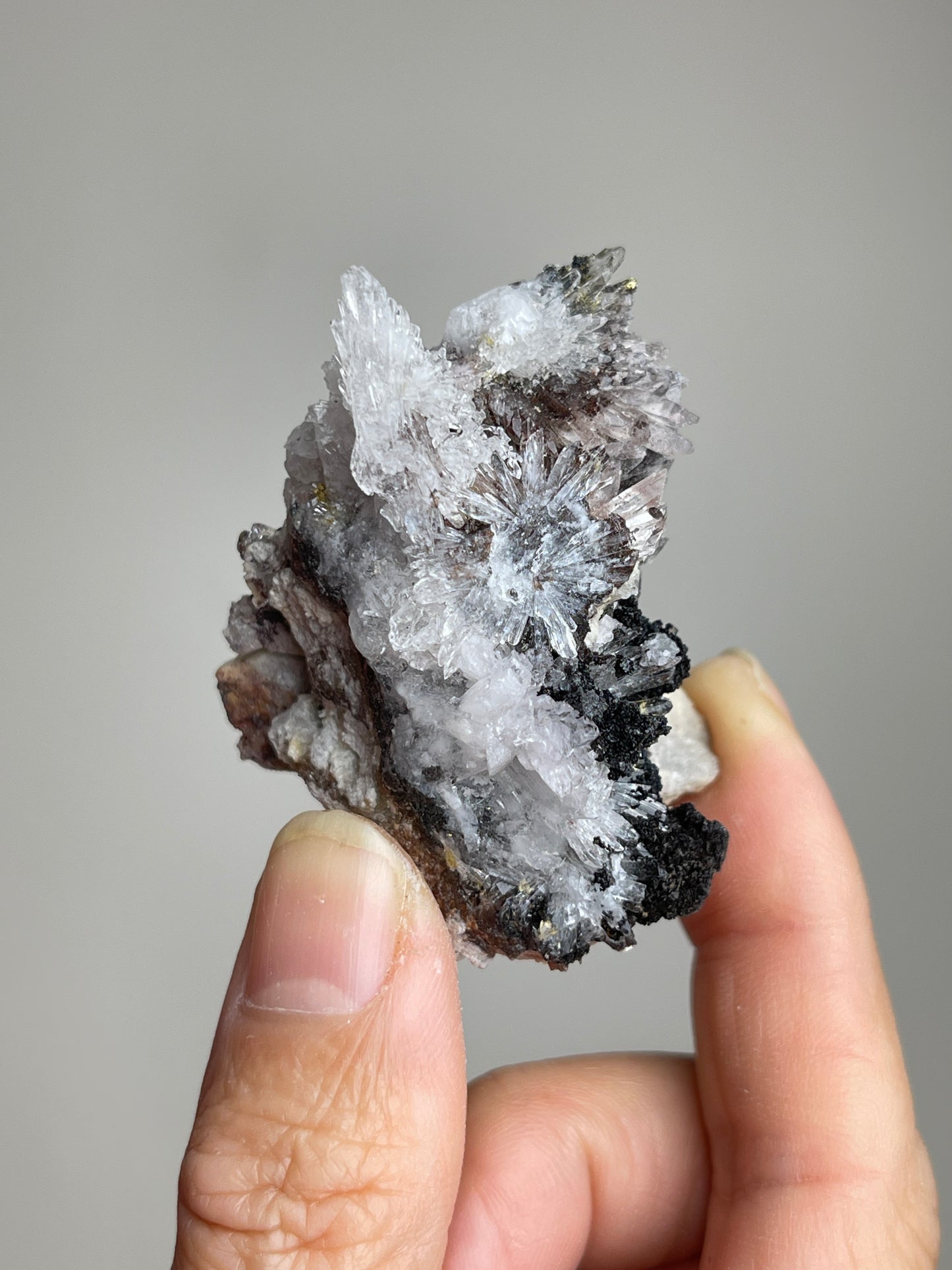 Back view of Raw Creedite mineral specimen showing natural host rock texture