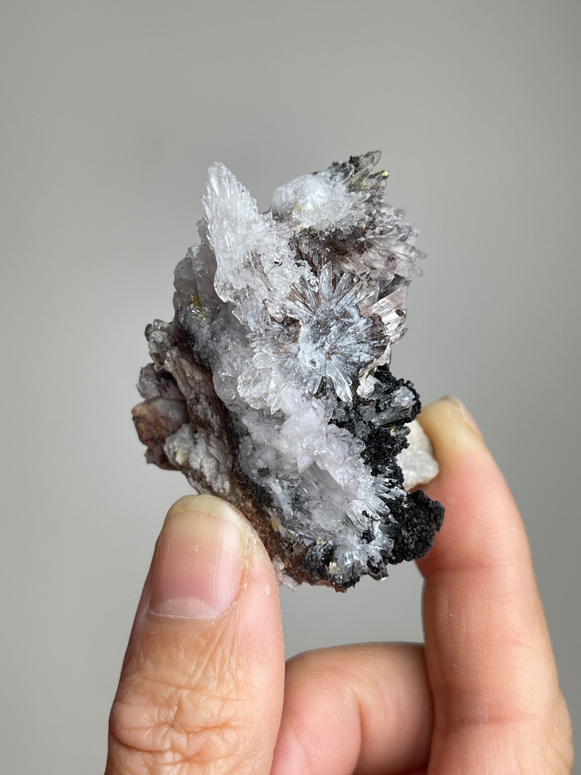 Back view of Raw Creedite mineral specimen showing natural host rock texture