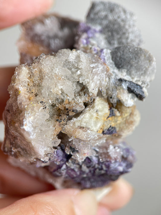 Close-up of radiating Creedite crystal sprays on natural matrix