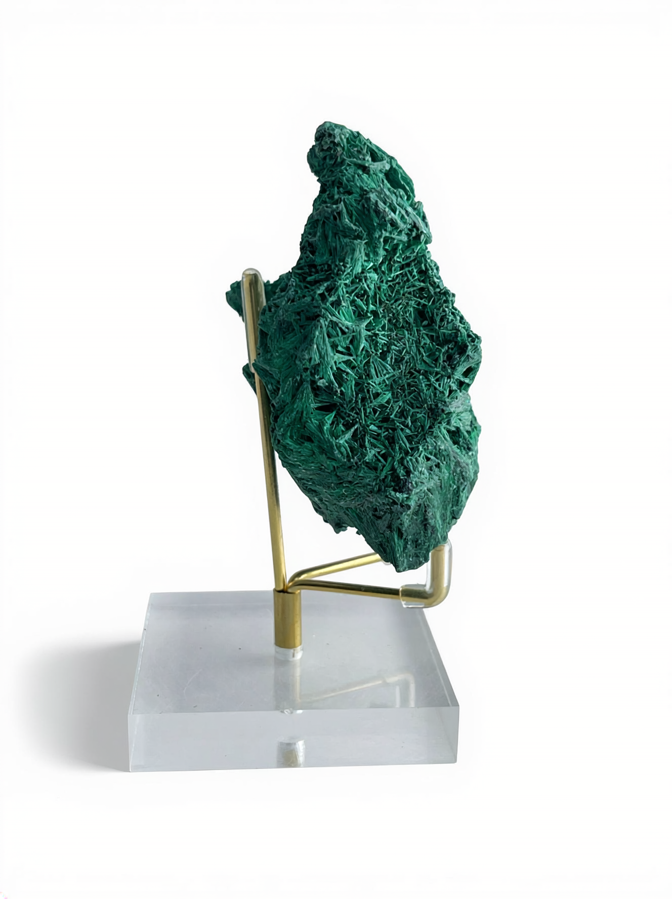 Raw fibrous malachite cluster mineral specimen on display stand, side view