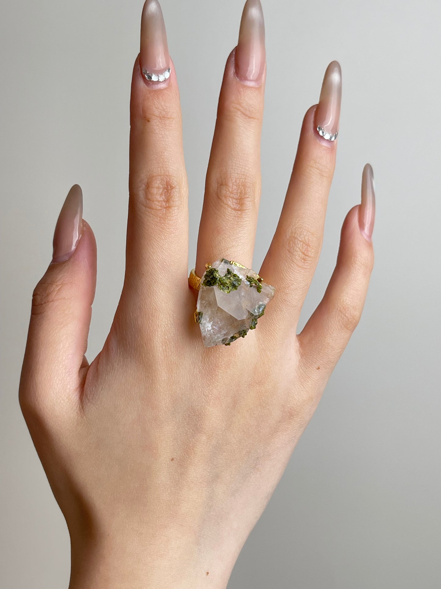Raw garden quartz with epidote ring worn
