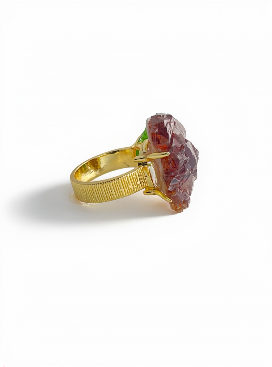 Side view of raw garnet and chrome diopside ring