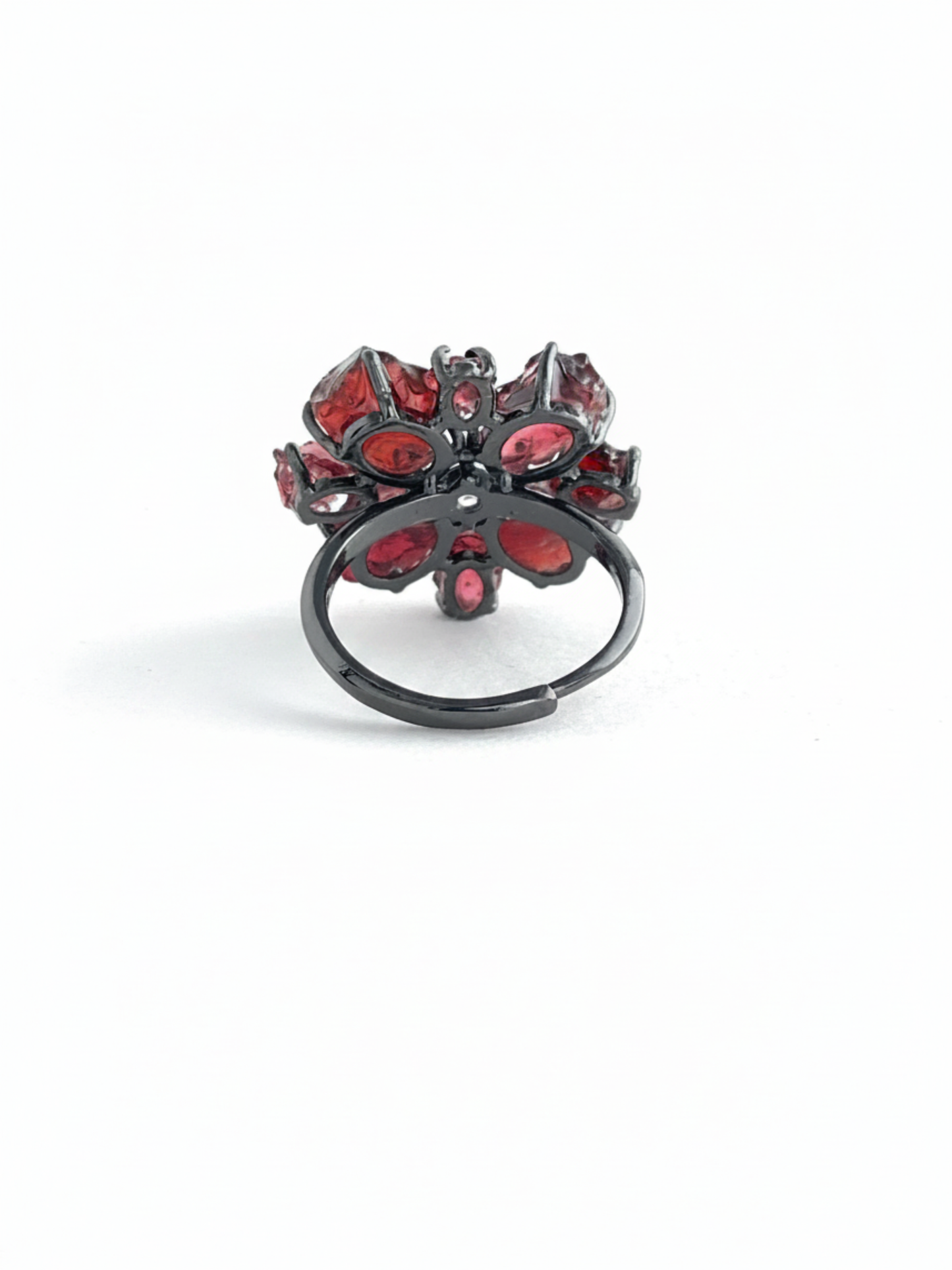 Back view of raw garnet snowflake ring with adjustable open band and gunmetal-tone finish