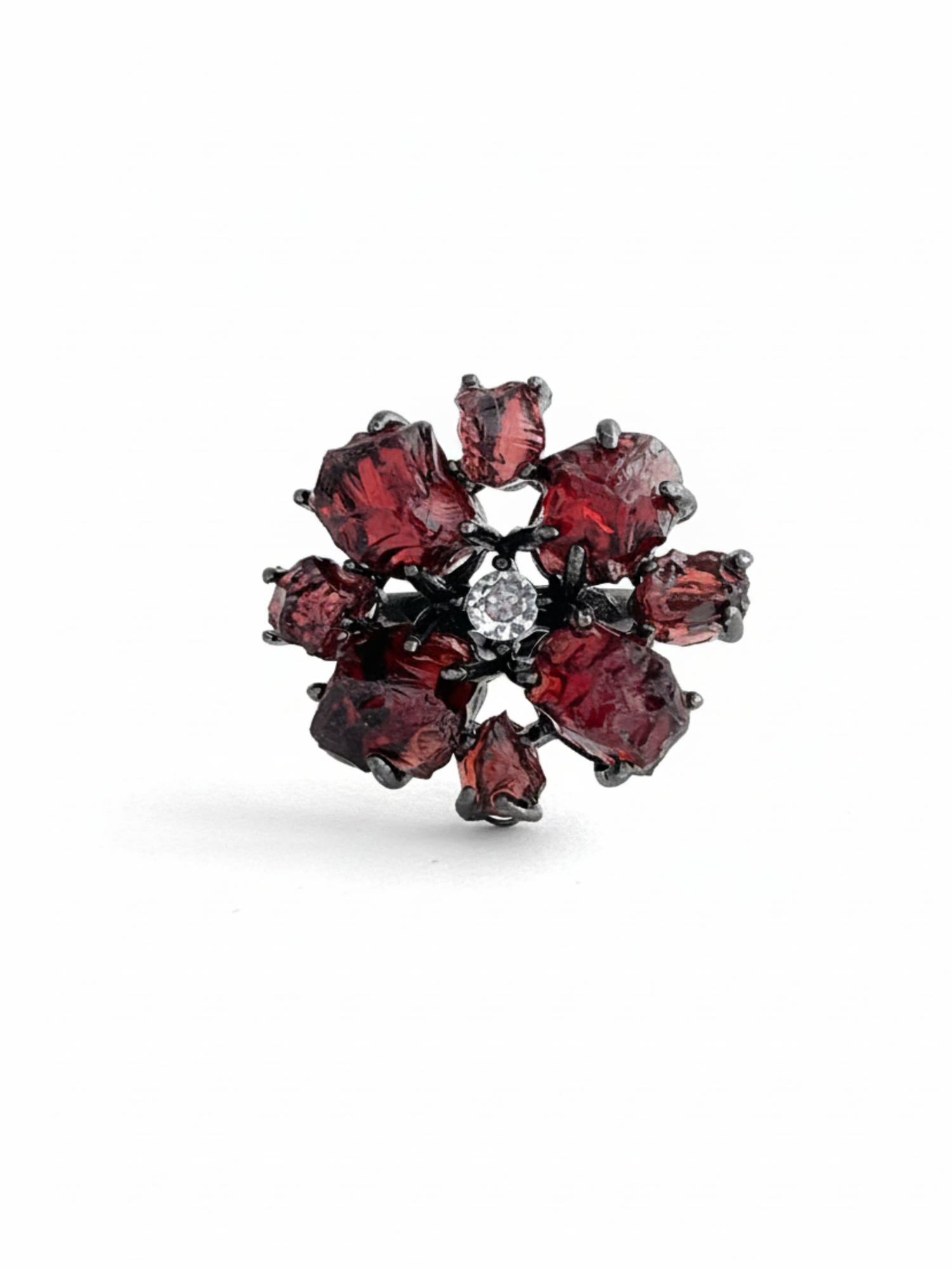 Raw garnet snowflake ring with deep red Sri Lankan garnet stones in a gunmetal-tone setting