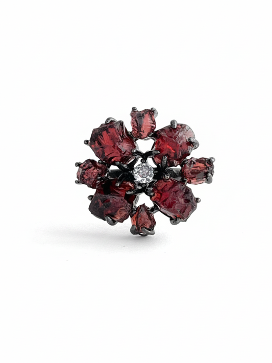 Raw garnet snowflake ring with deep red Sri Lankan garnet stones in a gunmetal-tone setting