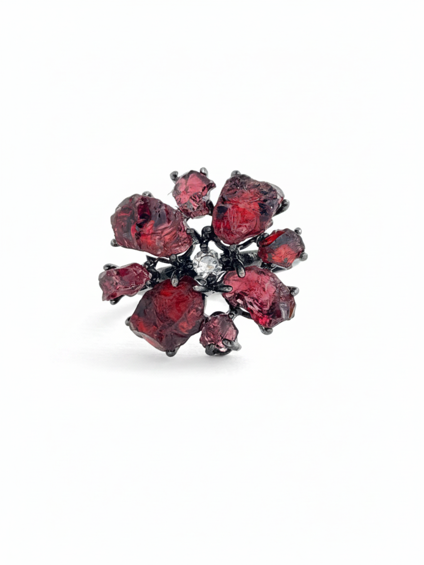 Raw garnet snowflake ring with deep red Sri Lankan garnet stones in a gunmetal-tone setting