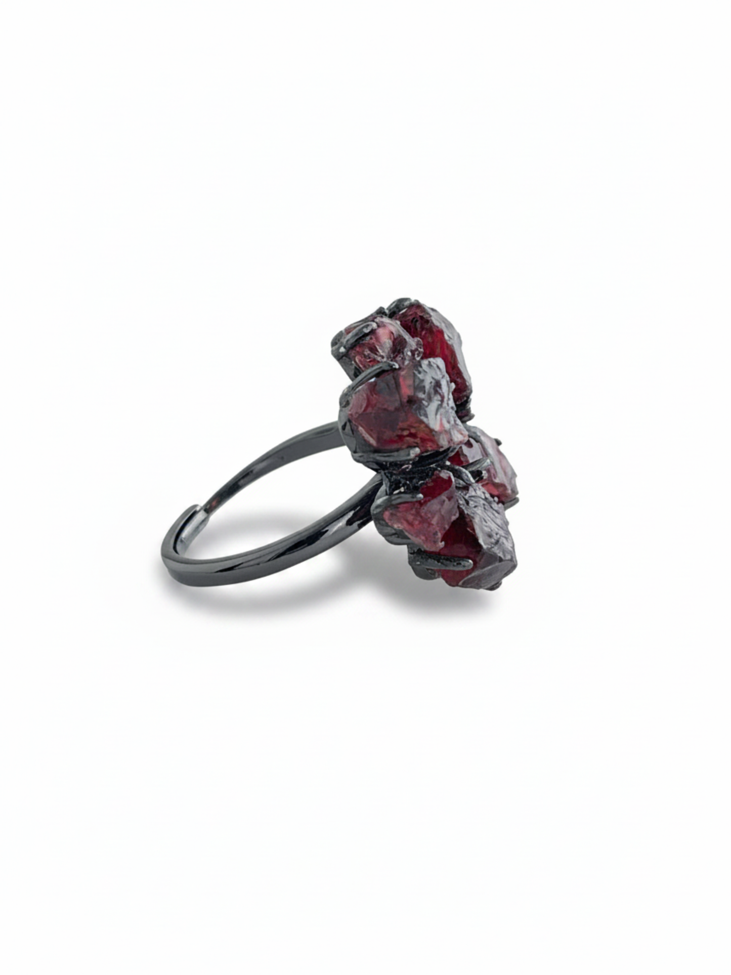Side view of raw garnet snowflake ring showing natural garnet texture and gunmetal-tone setting